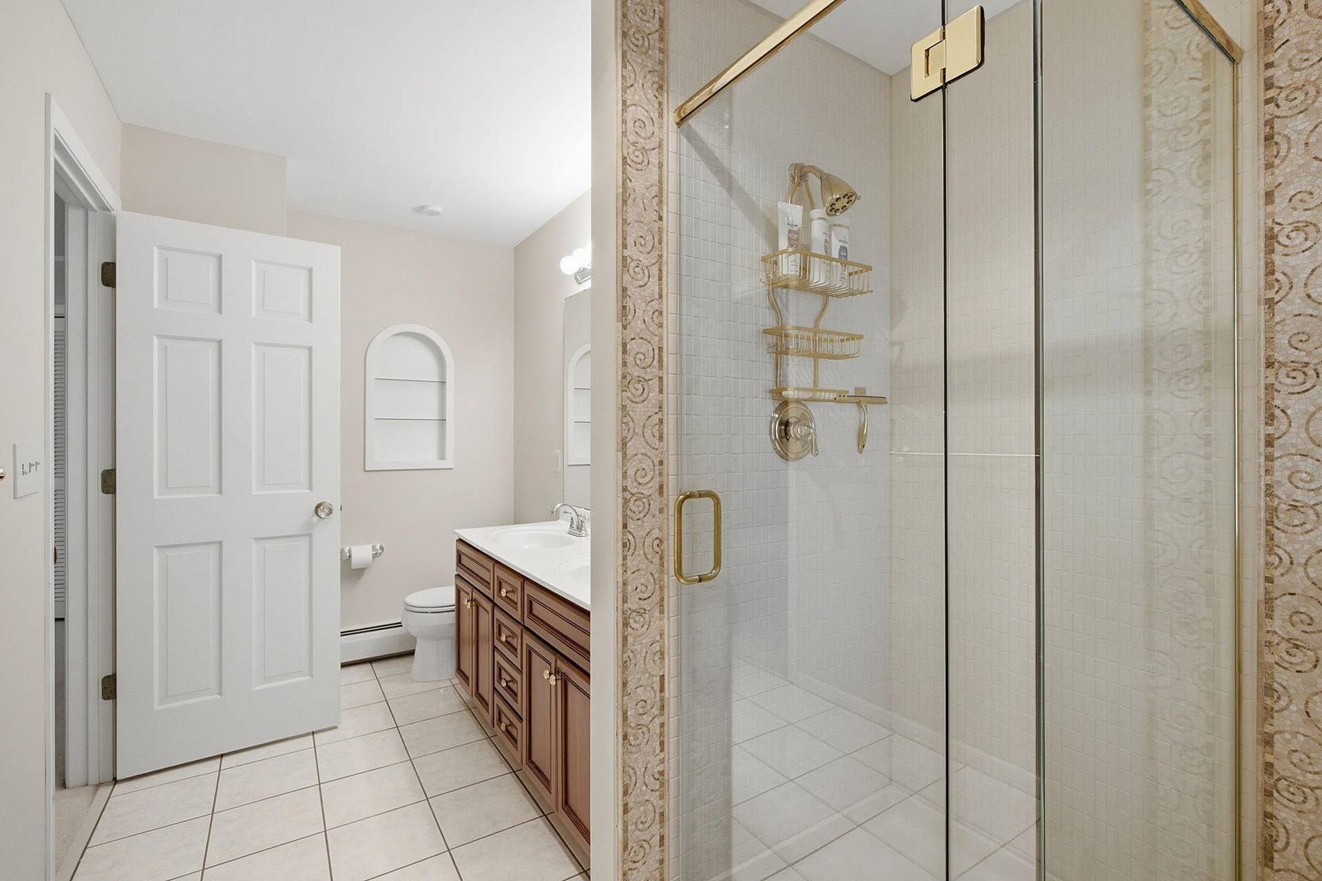 1330 Urbandale Lane N, Plymouth, MN 55447 Primary bathroom features double sinks, tile flooring, and a walk-in shower