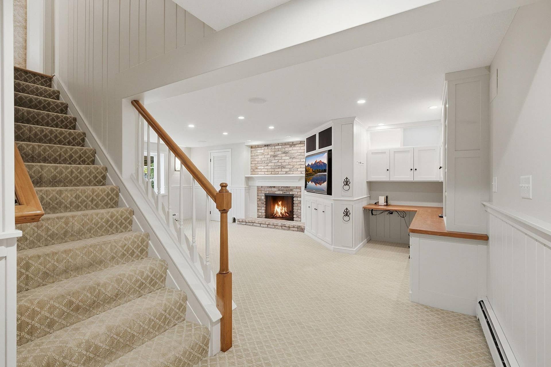 1330 Urbandale Lane N, Plymouth, MN 55447 Head down to the lower level family room with cozy wood burning fireplace