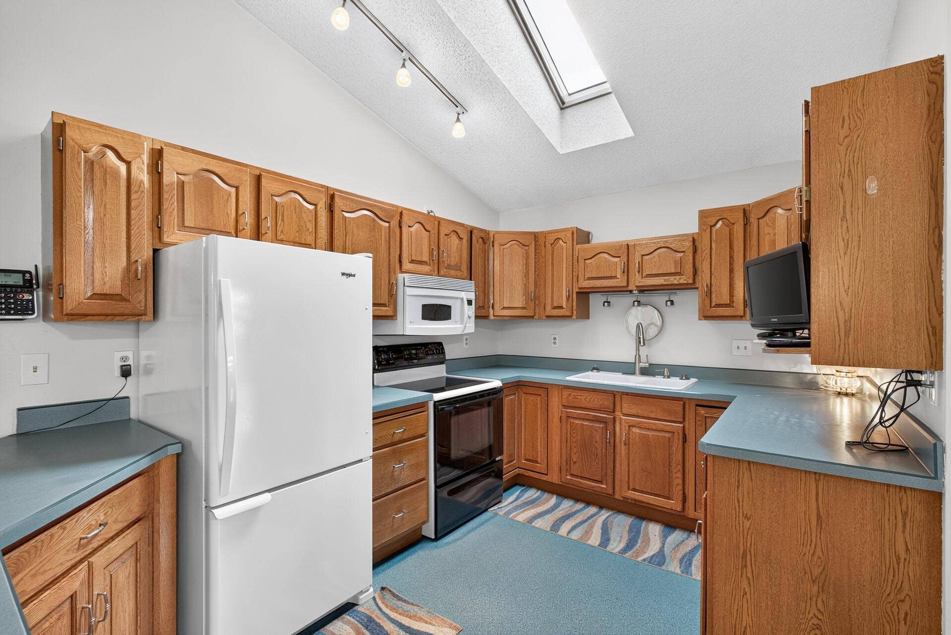1608 Tierney Drive, Hastings, MN 55033 Flooring & cabinet updates do wonders! Lots of nice cabinets and good working space.