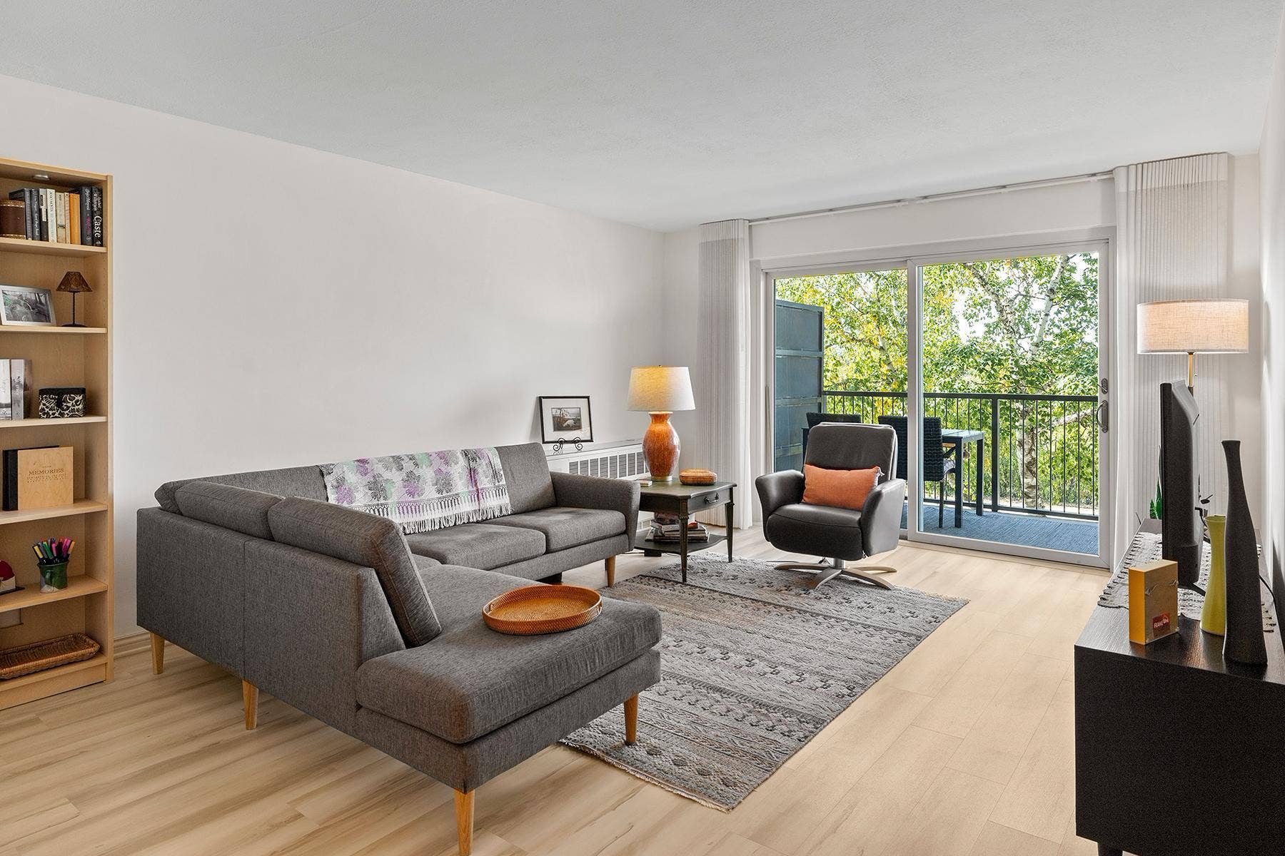 200 Mississippi River Boulevard N, #1C, 96, Saint Paul, MN 55104 Living room features Scandinavian-style LVP flooring (new in past 5 years) and freshly painted walls (2026).