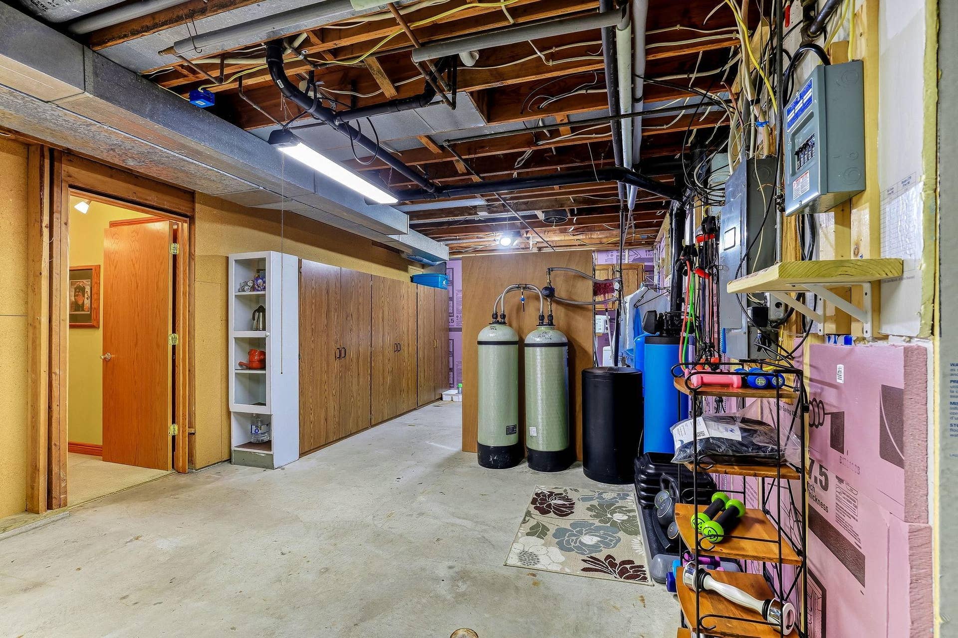 1401 Omaha Avenue N, Stillwater, MN 55082 Tons of storage space in this lower level. See floor plans for dimensions and layout. Notice carbon filtration system in the background. All part of the 3M settlement with the state of MN. The system is provided and maintained at NO expense!