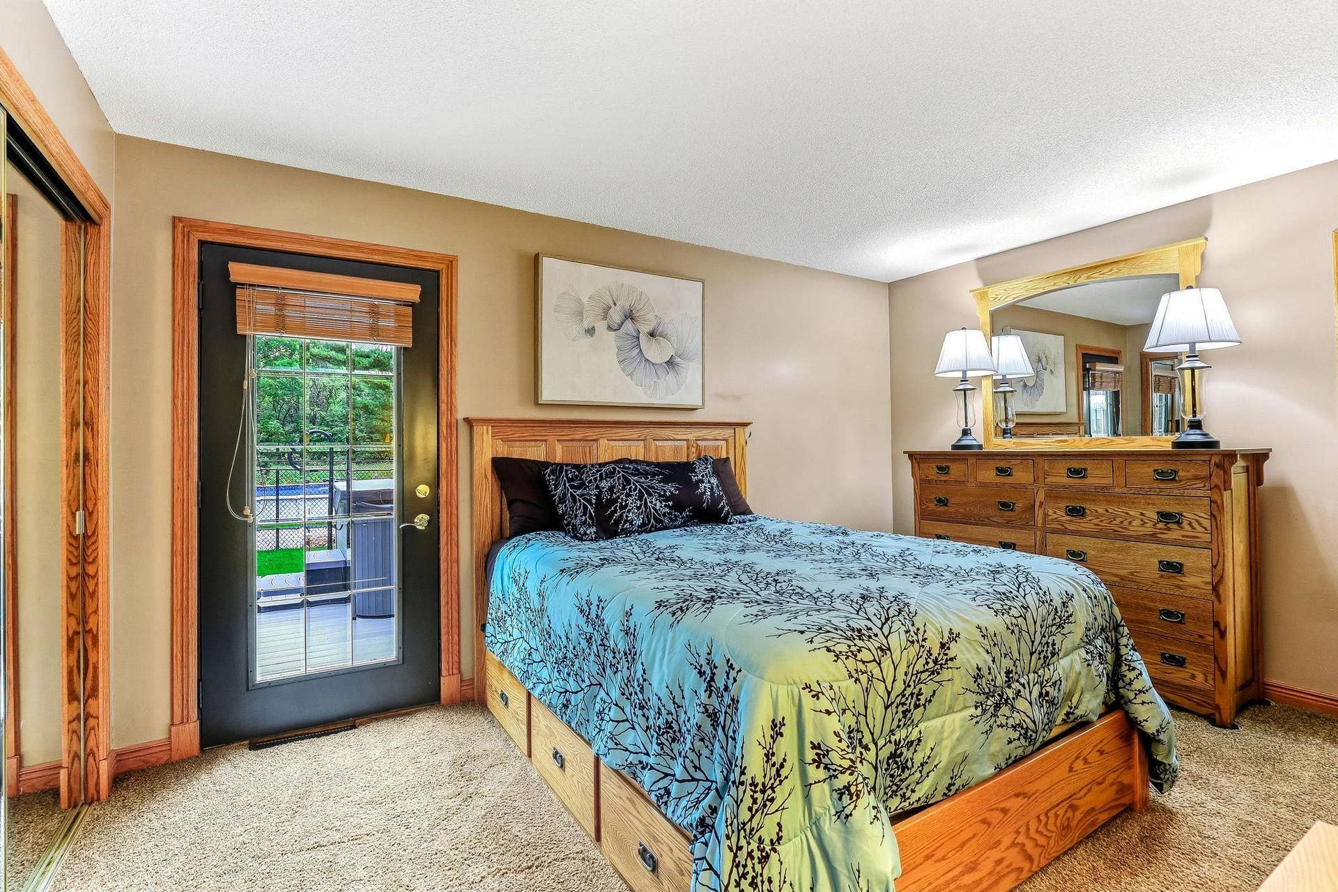 1401 Omaha Avenue N, Stillwater, MN 55082 Main floor primary bedroom with walkout to deck and hot tub, plus a walk through bath attached.