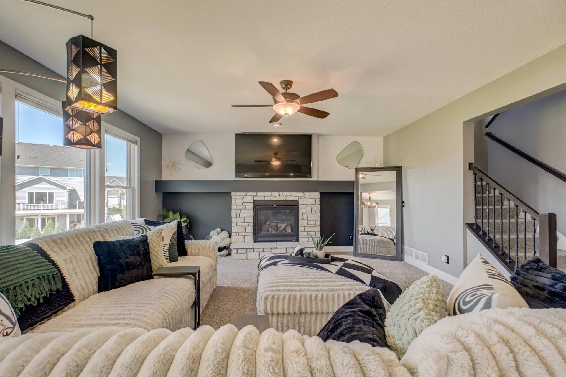 The open-concept great room is filled with natural light, creating an inviting space for everyday living and entertaining!