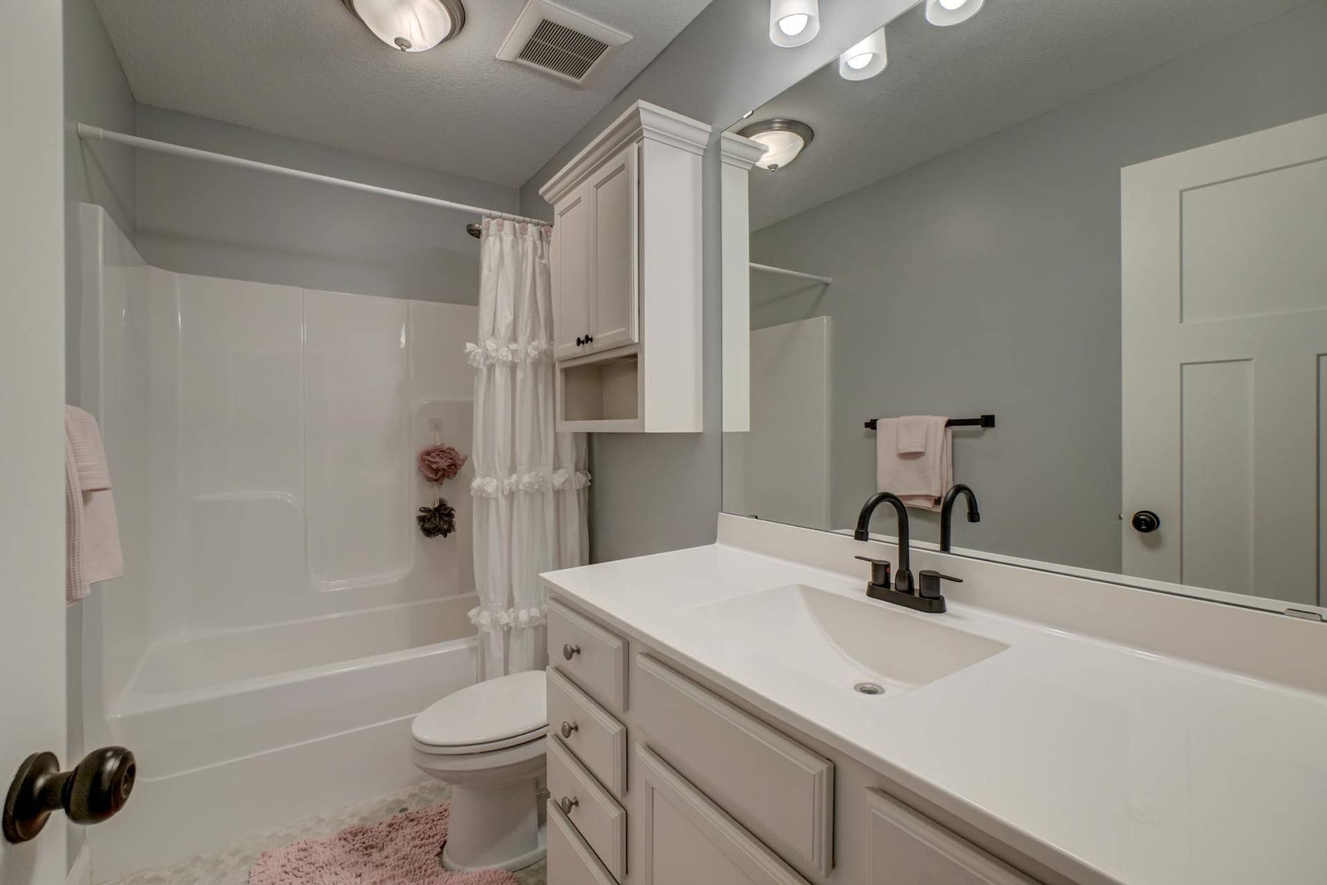 Connected ensuite bathroom provides private access