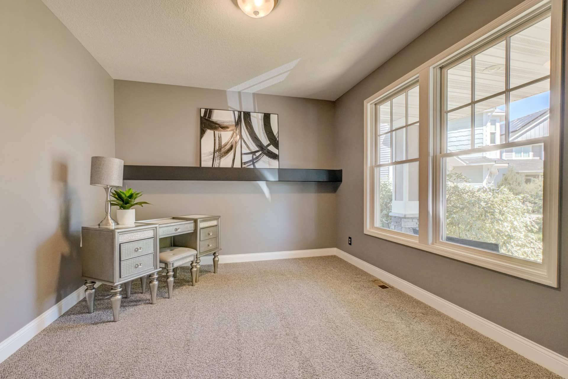 The versatile room is ideal for a home office, playroom, reading nook, or additional living space!