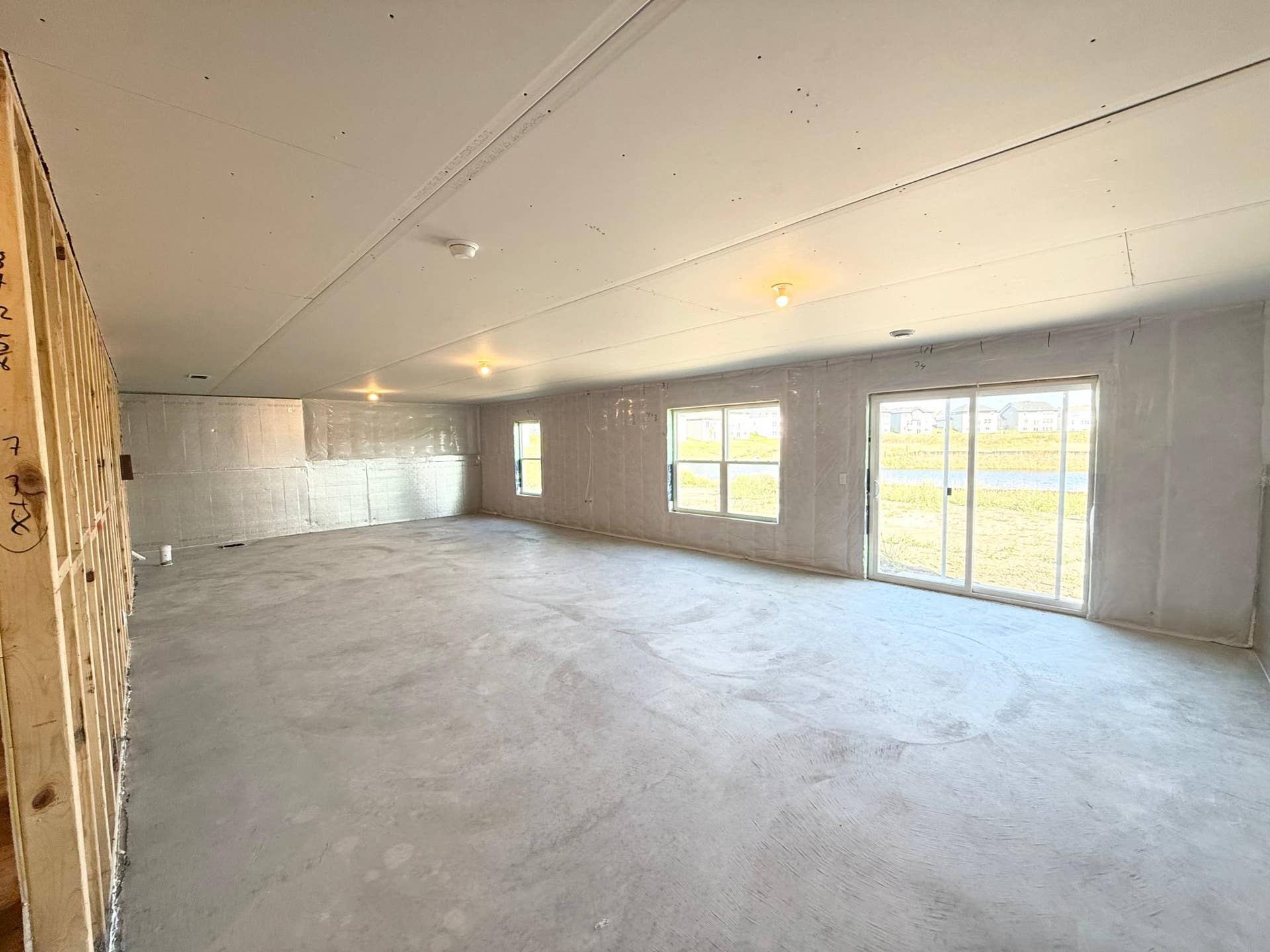 Photo From Actual Home: Large Walkout lower level, perfect for a future Family room, bedroom, and bathroom.