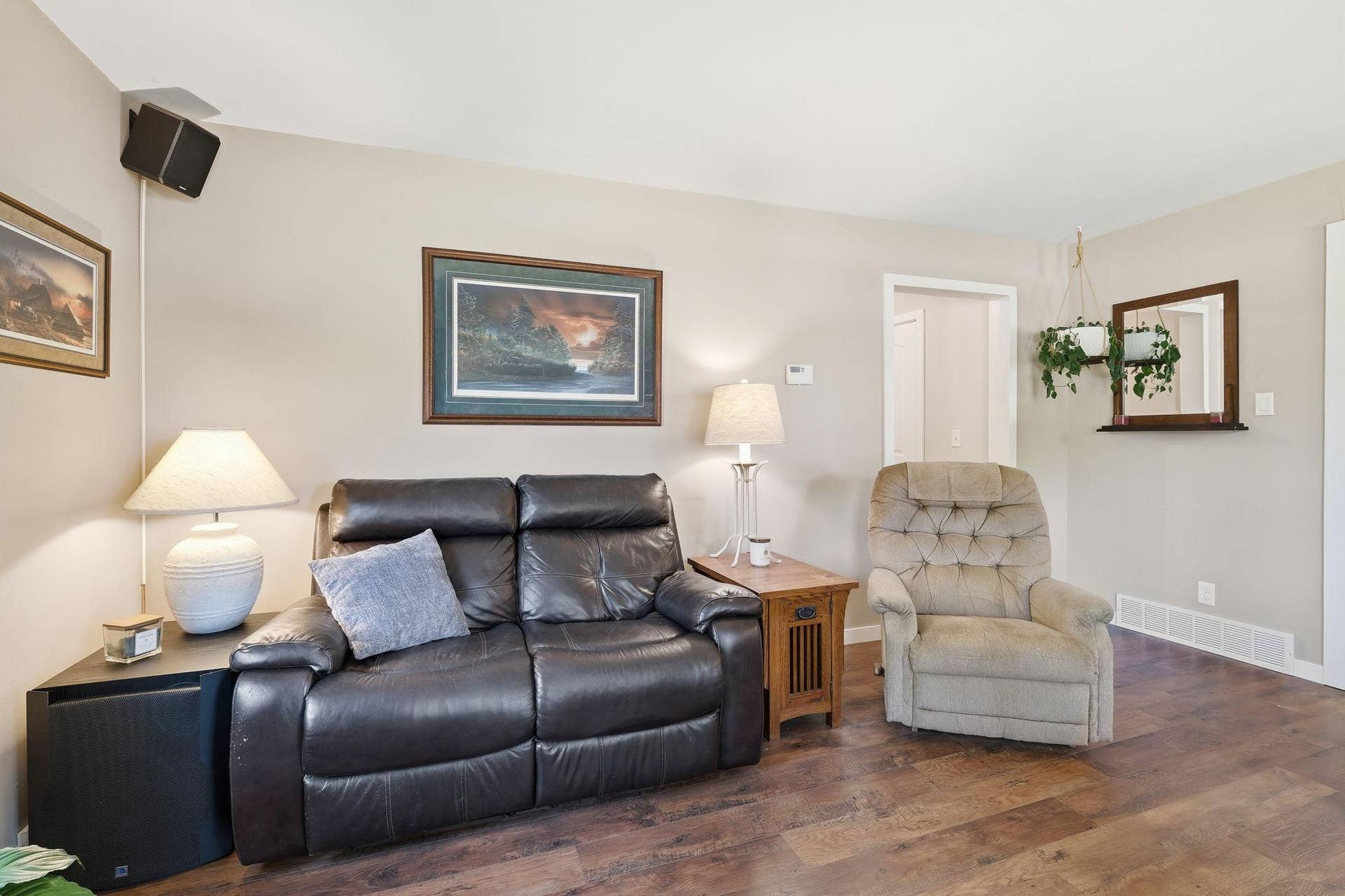 611 Central Avenue, Buffalo, MN 55313 Inviting living room featuring warm wood-look flooring and a soft, neutral palettean ideal space to relax or gather with guests.