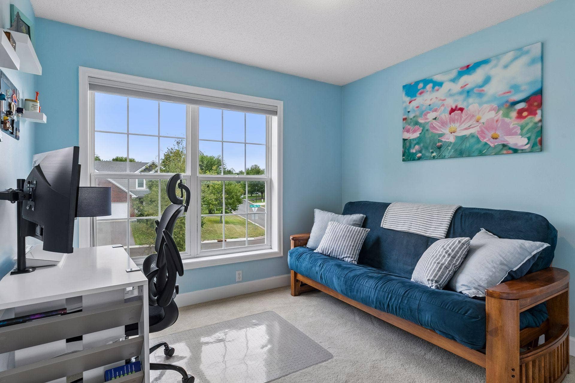 957 Lake Ridge Bay, Woodbury, MN 55129 The second of three upper level bedrooms offers excellent flexibility, currently serving as a home office with a large double window, carpet flooring, overhead lighting, and double closet.