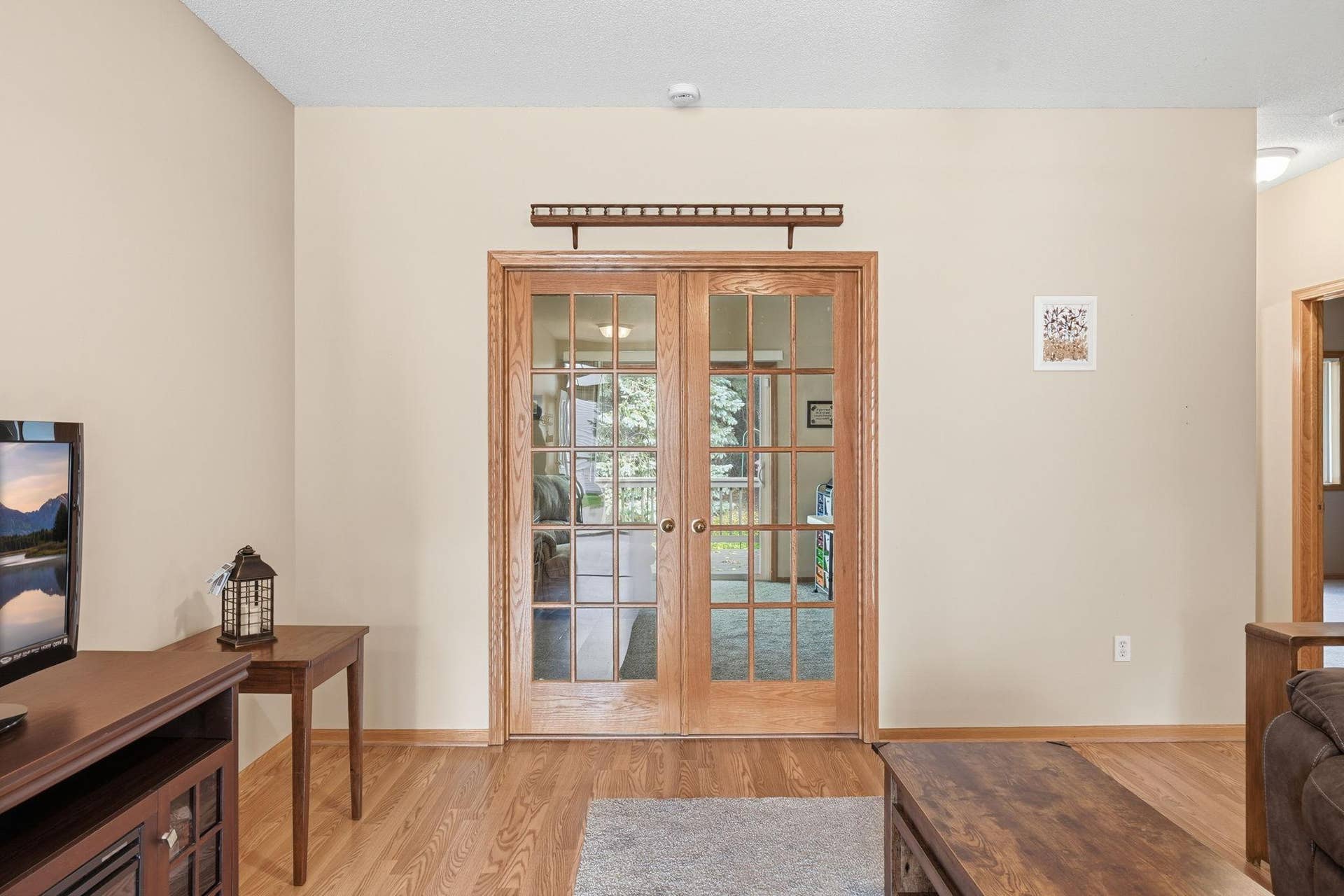 French doors lead to the den or second bedroom