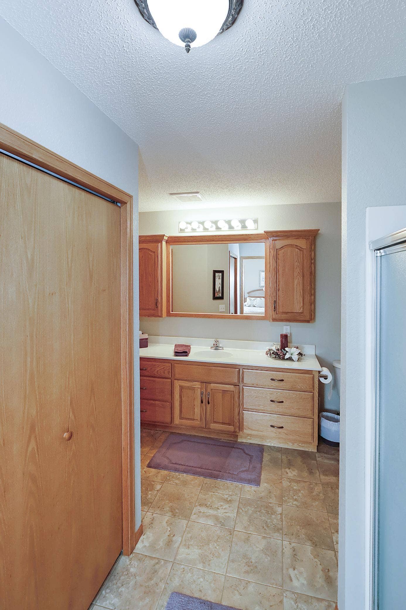 Primary ensuite with walk-in closet on the left.