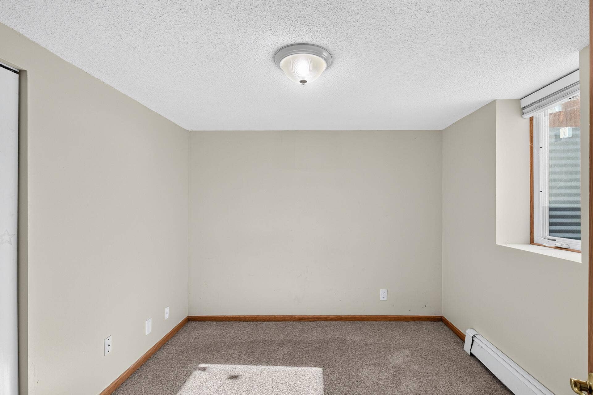 Bedroom or home office? This lower level room features an egress window and the versatility to be whatever you need it to be.