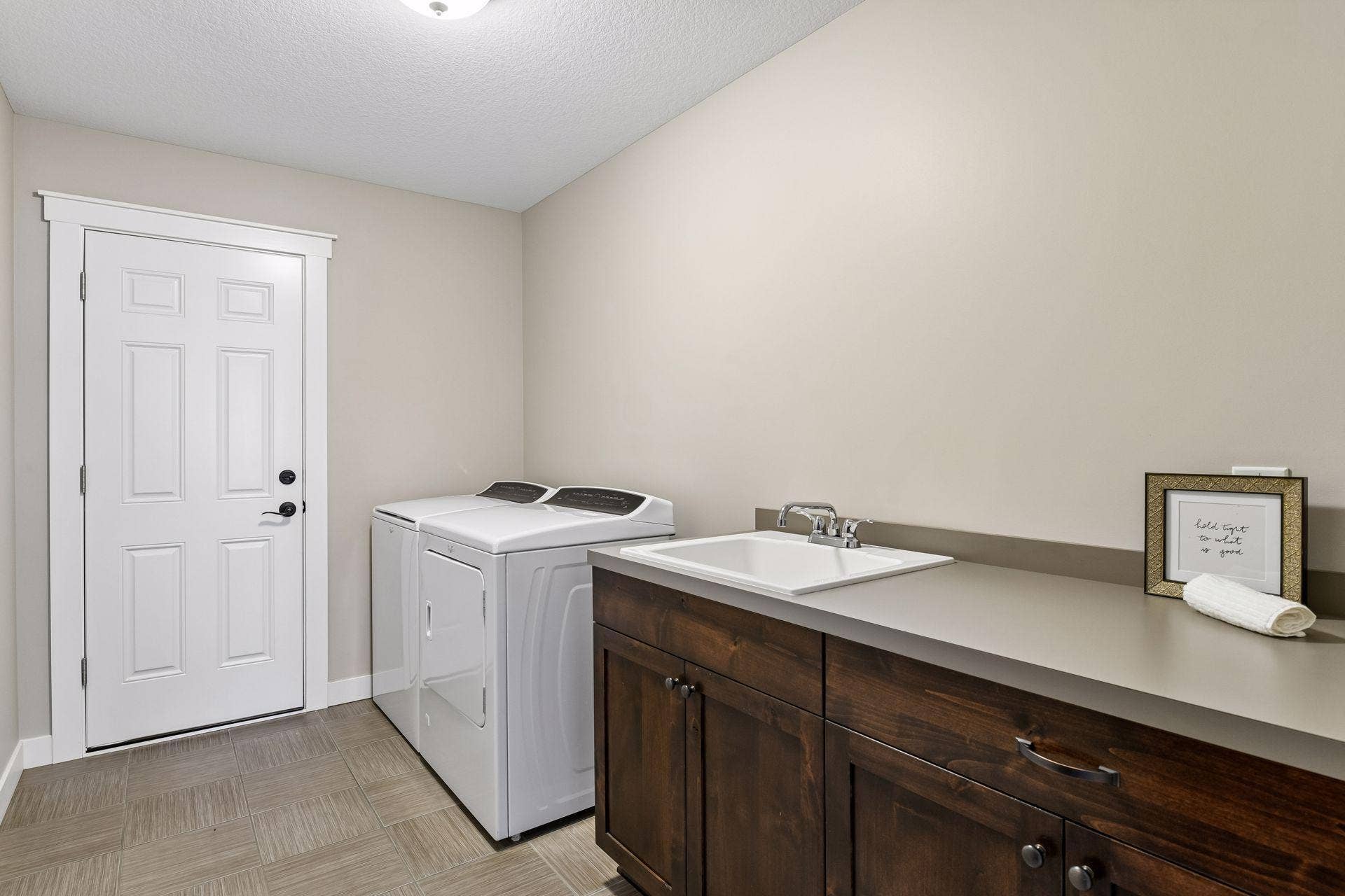 2444 Woods Drive, Victoria, MN 55386 Upper level laundry room.