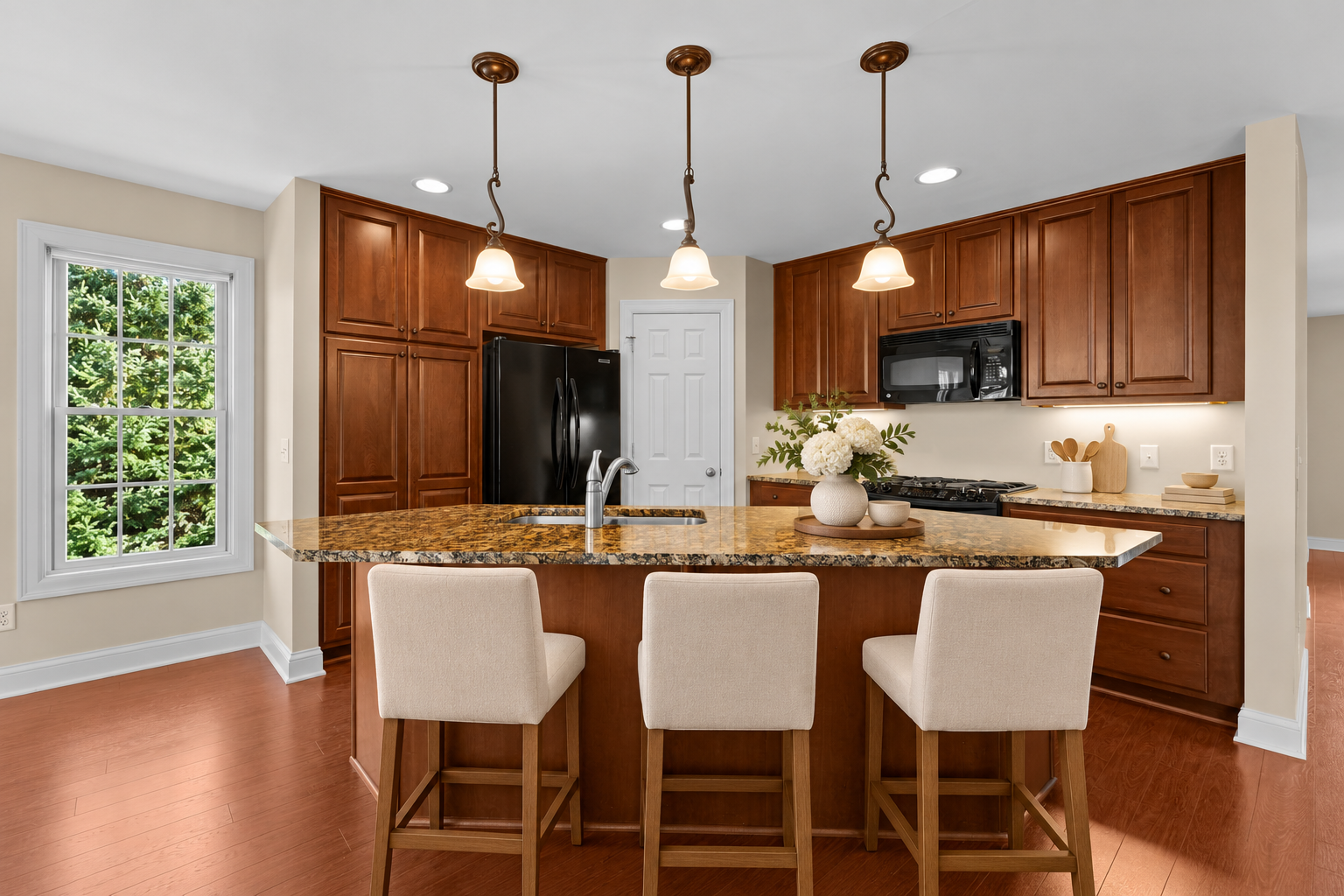 Gorgeous Center island with granite countertops, cherry cabinets, and tons of storage!