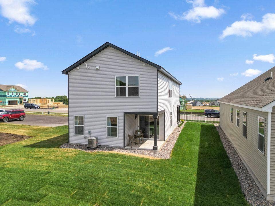 859 Stoneridge Parkway, Dundas, MN 55019 The Ferguson. Enjoy your covered patio!! Photo of Bluff View Model home. Exterior colors may vary.