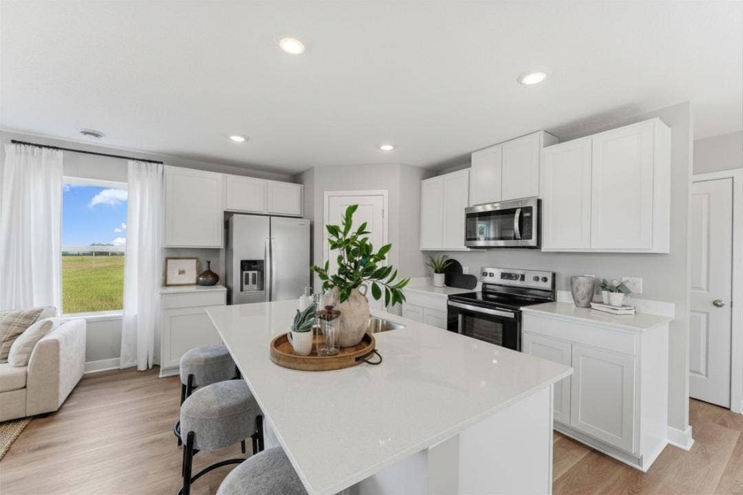 859 Stoneridge Parkway, Dundas, MN 55019 Spacious kitchen with large island for seating. Stainless steel appliance corner, walk-in pantry!