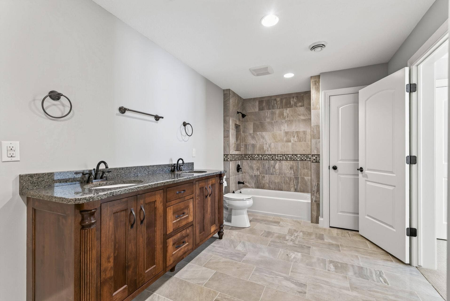 A full bathroom completes the lower level, allowing guests to enjoy a comfortable and private space of their own.