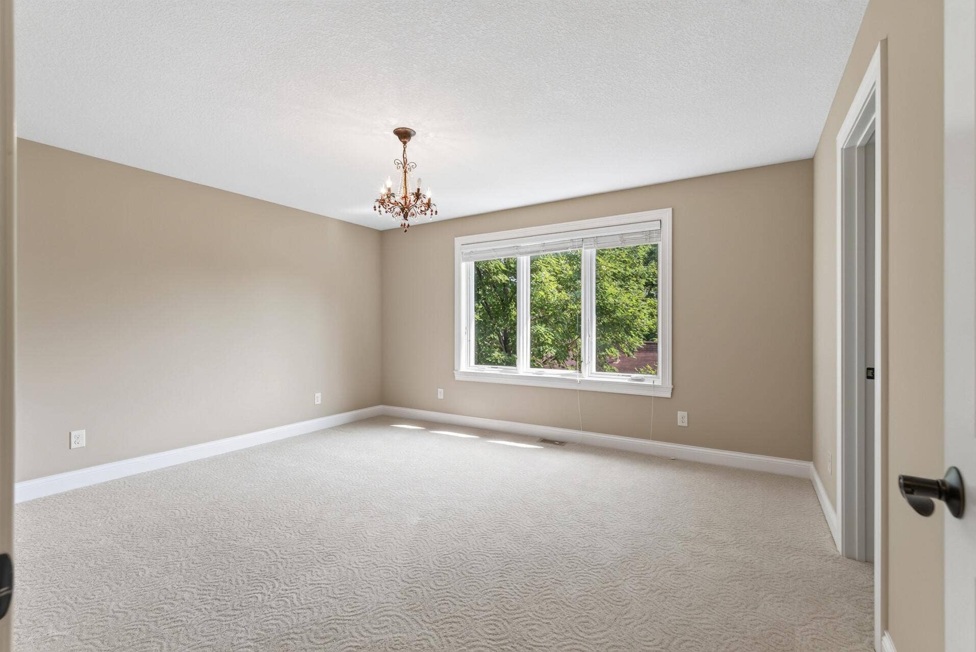 Another spacious upper-level bedroom continues the homes theme of generous proportions, offering wonderful flexibility for family, guests, or additional workspace.