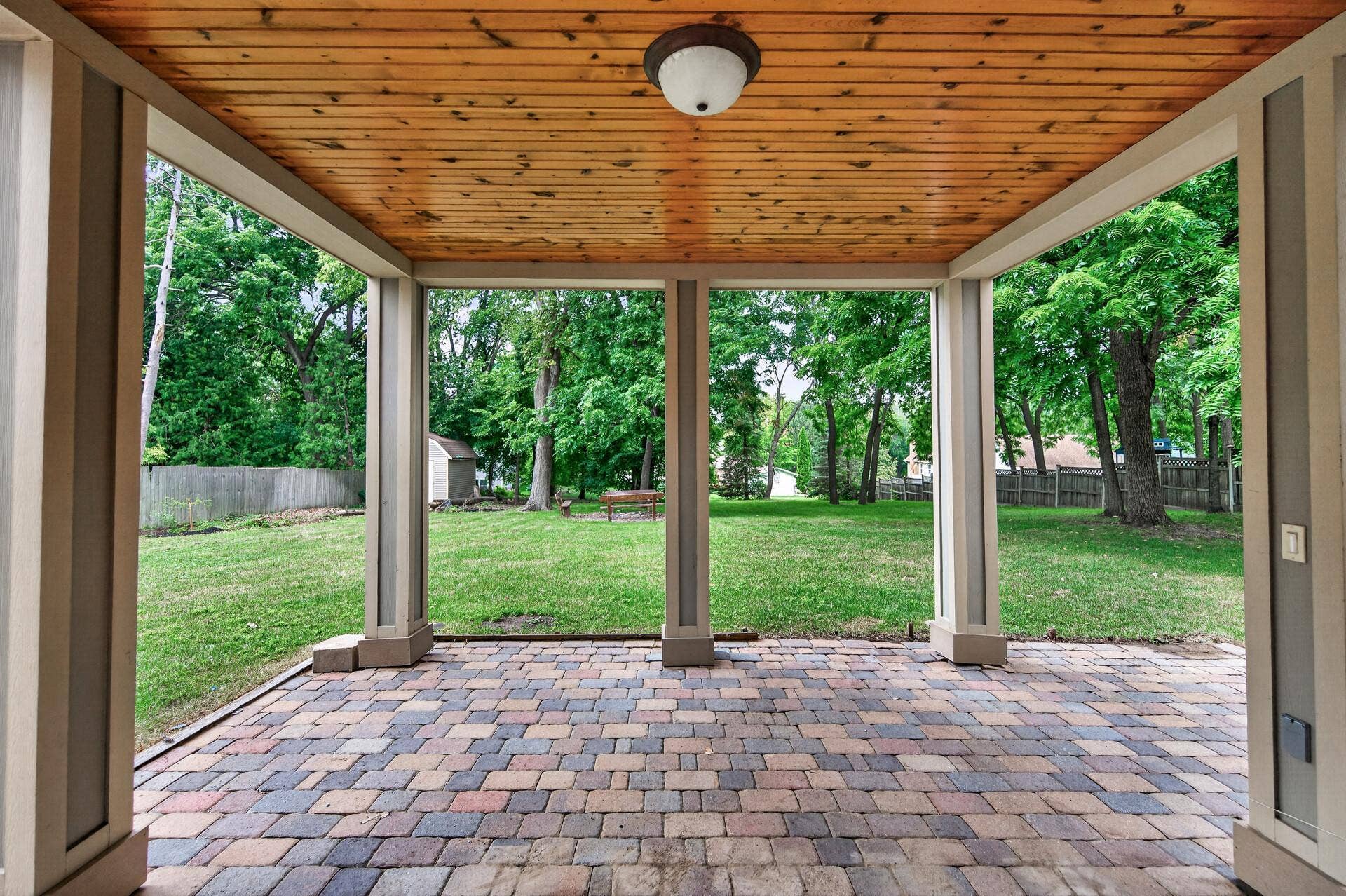 Walkout lower level - what a great multi-use covered space!