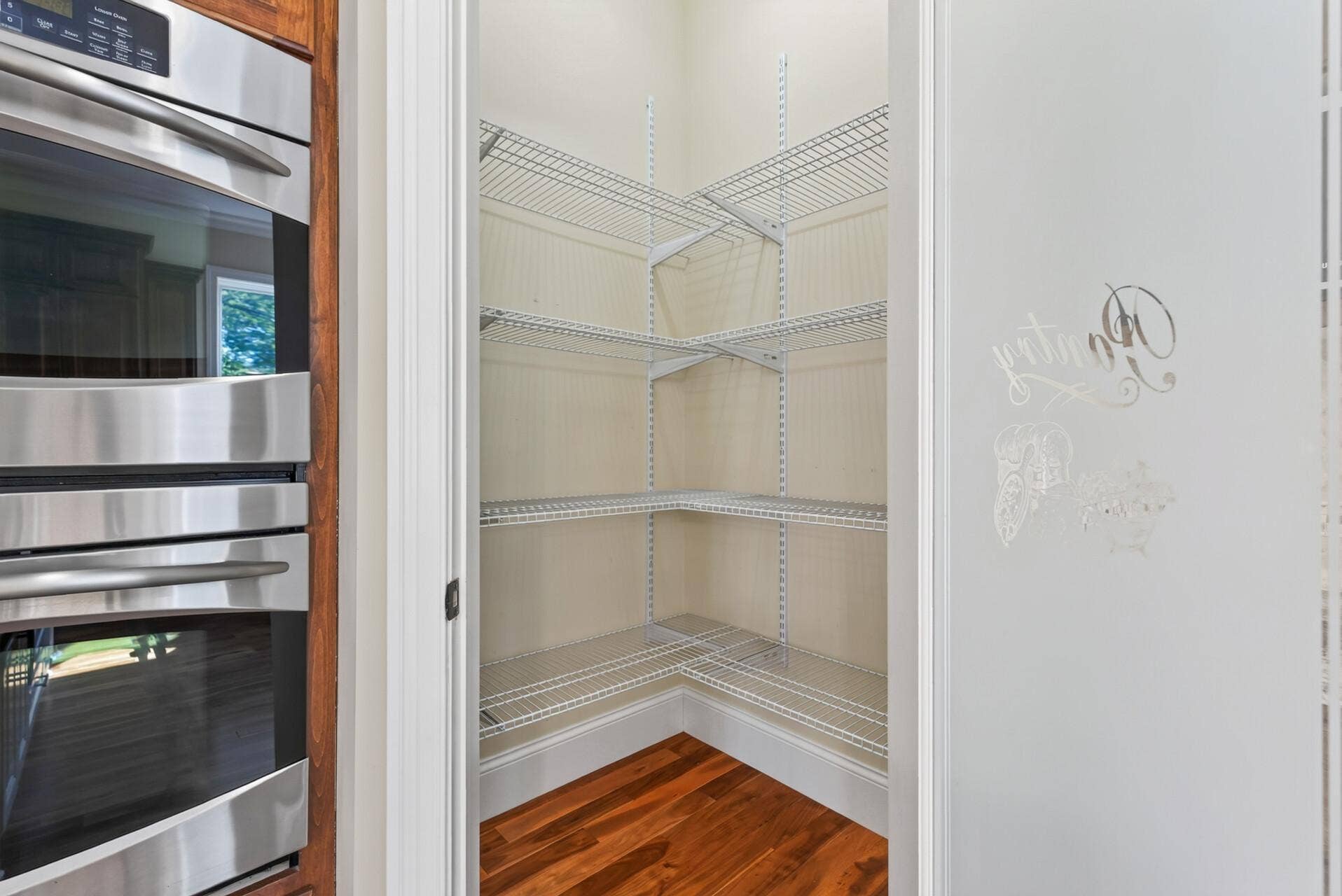 A spacious walk-in pantry keeps everything beautifully organized and within easy reach, adding another layer of thoughtful functionality to this impressive kitchen.