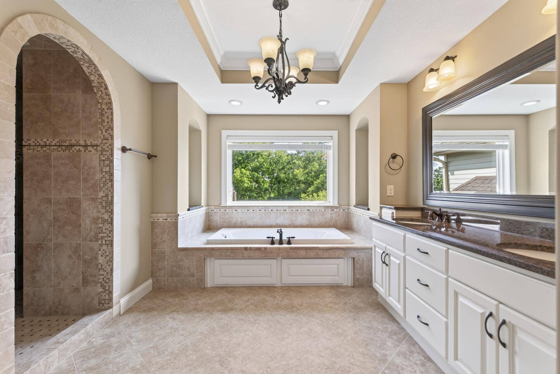 The private ensuite continues the primary suites sense of comfort and luxury.