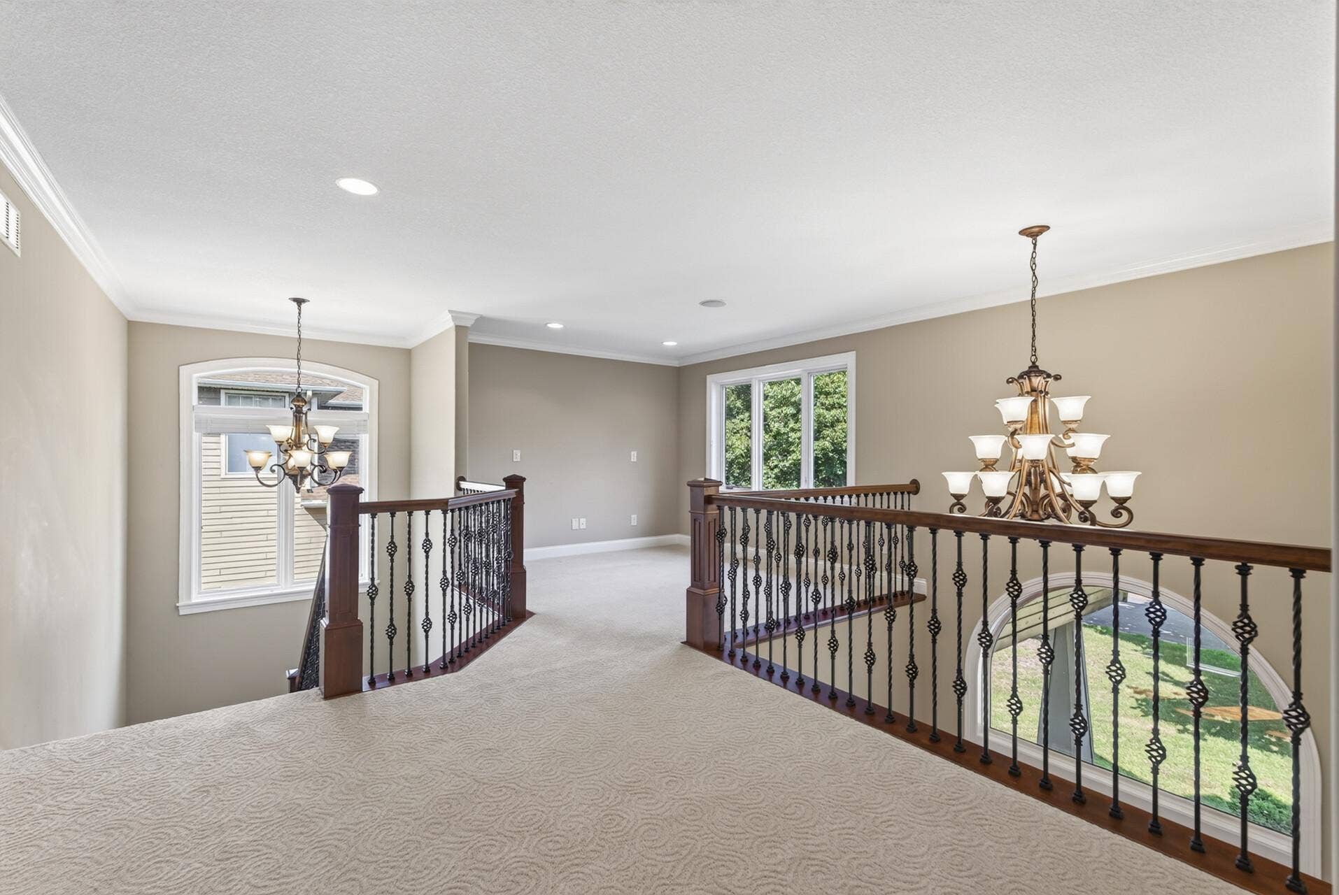 At the center of the upper level, a spacious loft adds another layer of flexibility to the home.