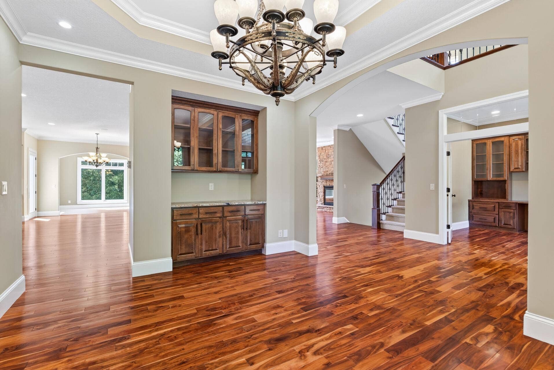 Glass-front built-in cabinetry adds both beauty and function to the formal dining room, offering the perfect place to display treasured pieces while elevating the space.