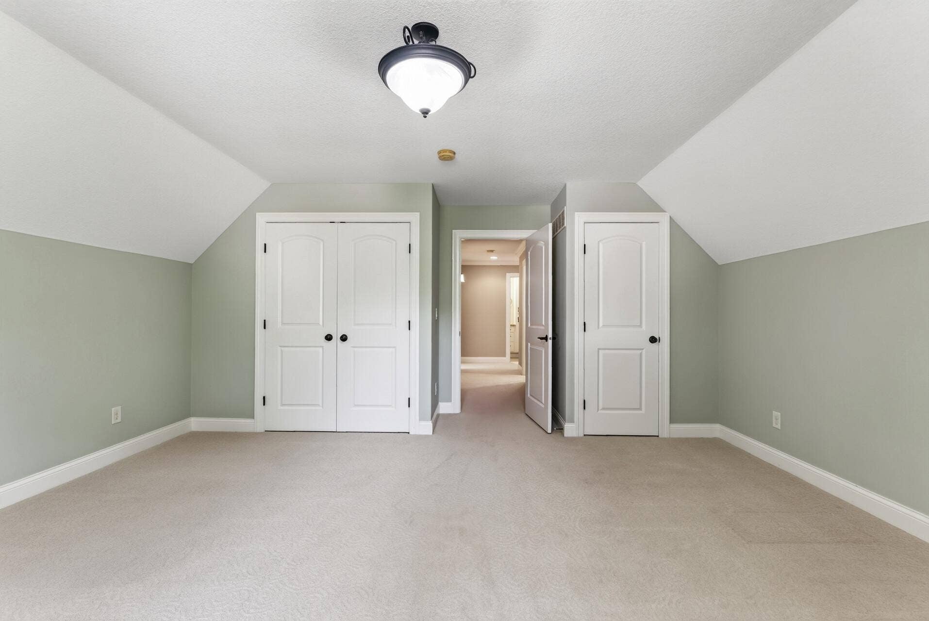 Two separate closets provide exceptional storage for this spacious bedroom, adding even more function to an already impressive space.