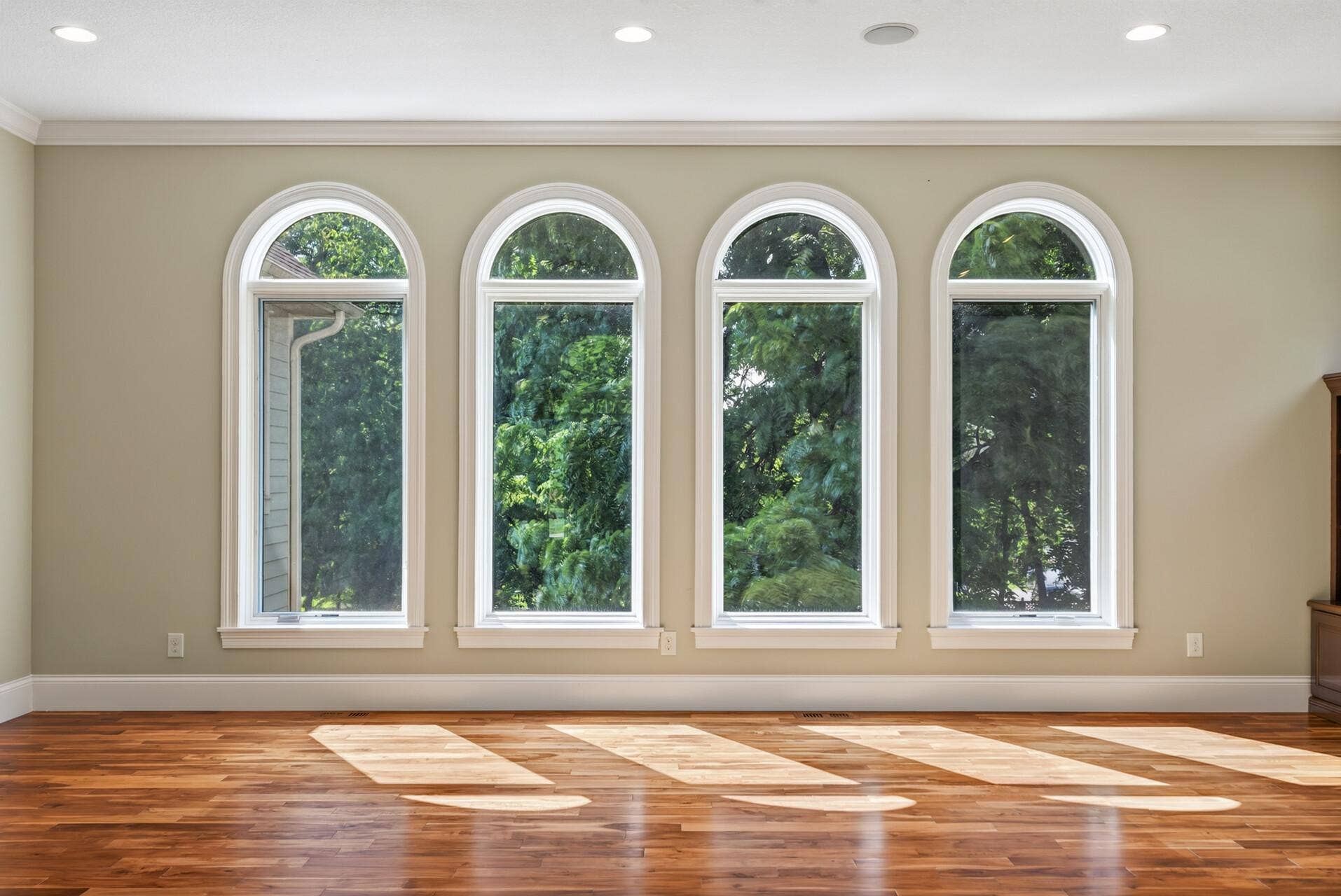 Natural light pours through oversized windows, adding to the homes open and airy feel.