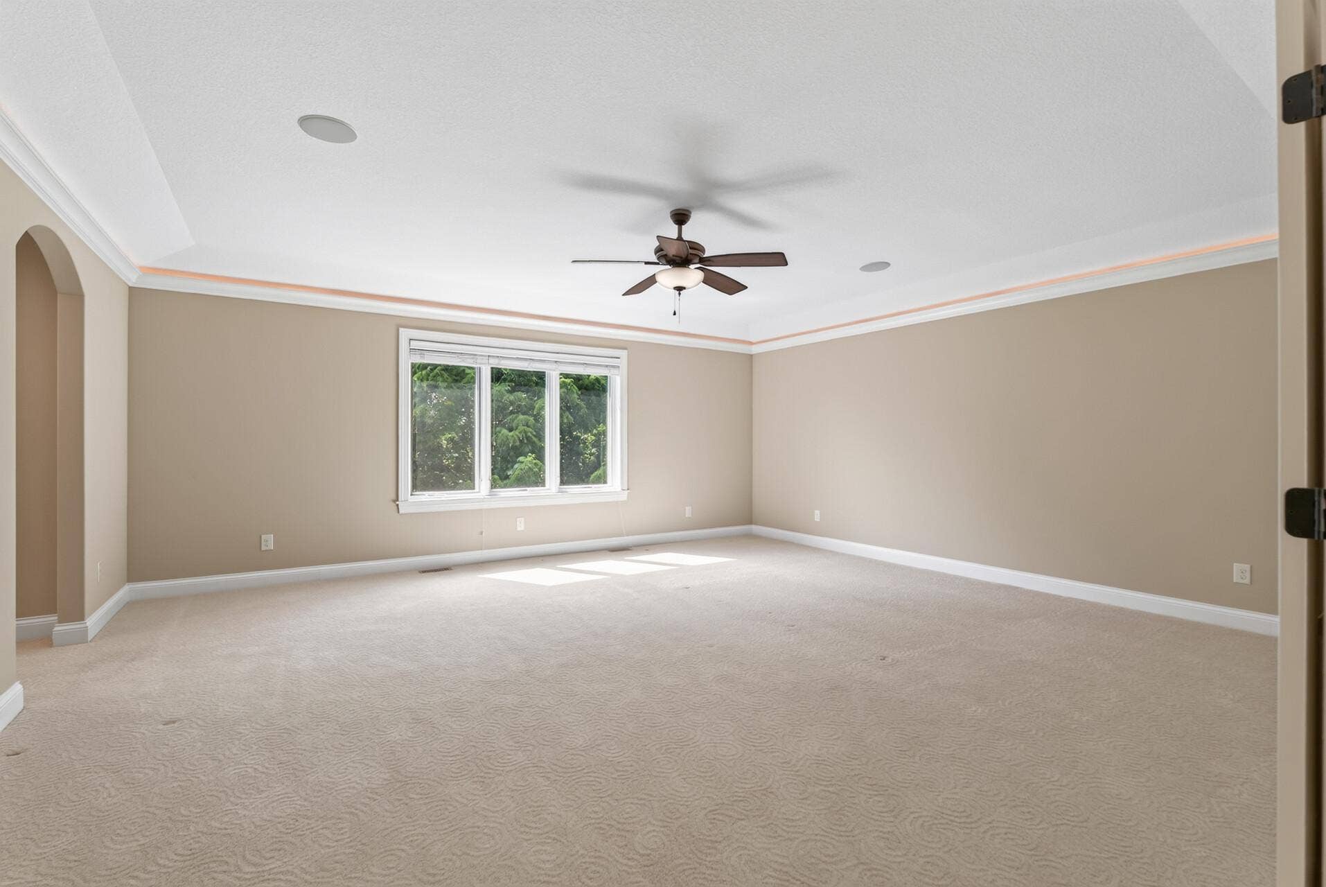 The upper-level primary suite is a true retreat, beautifully proportioned and thoughtfully designed.