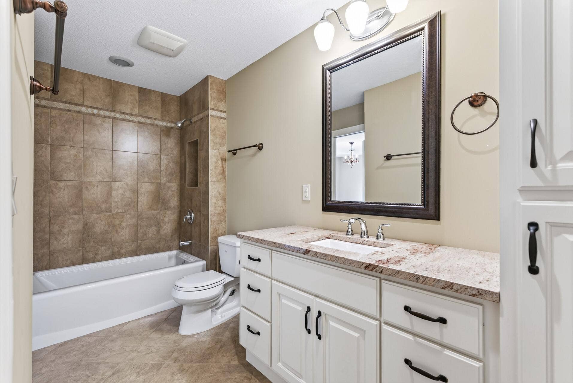 An additional upper-level full bathroom offers beautiful finishes and everyday convenience, thoughtfully positioned to serve the surrounding bedrooms.