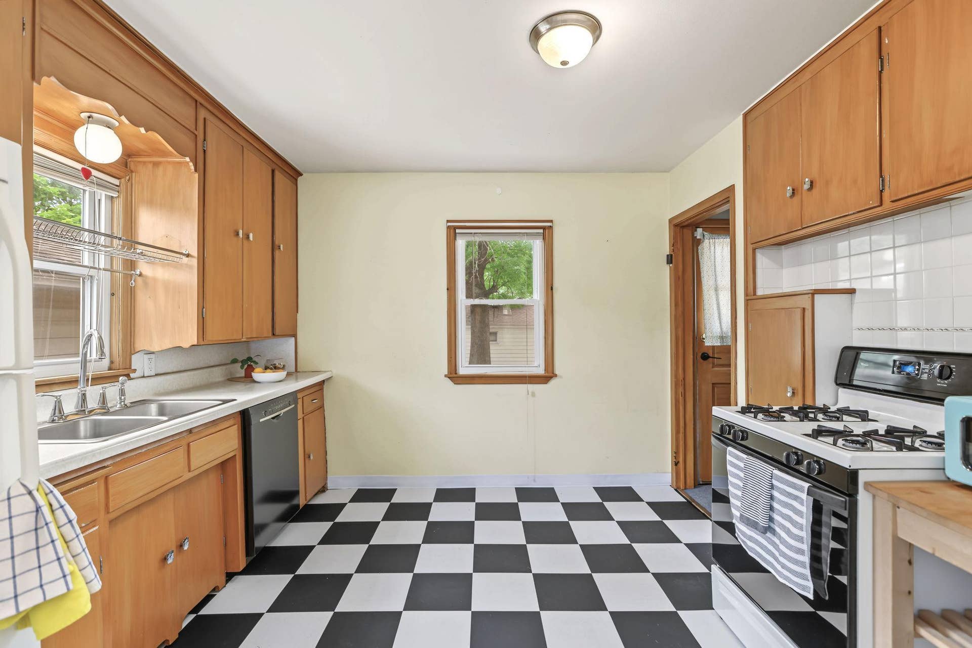 4018 Monroe Street NE, Columbia Heights, MN 55421 Fun checkerboard flooring is a perfect compliement to the vintage look