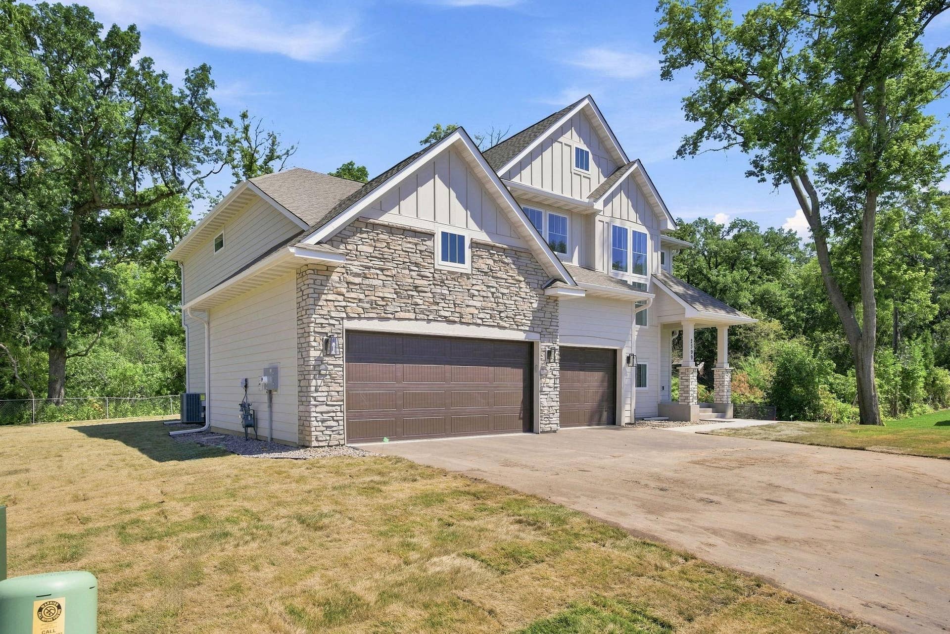 2399 Laurie Court W, Roseville, MN 55113 Custom-designed and newly built in 2025! Front exterior view of the property from an angle. Showcasing exceptional craftsmanship and thoughtful design throughout.