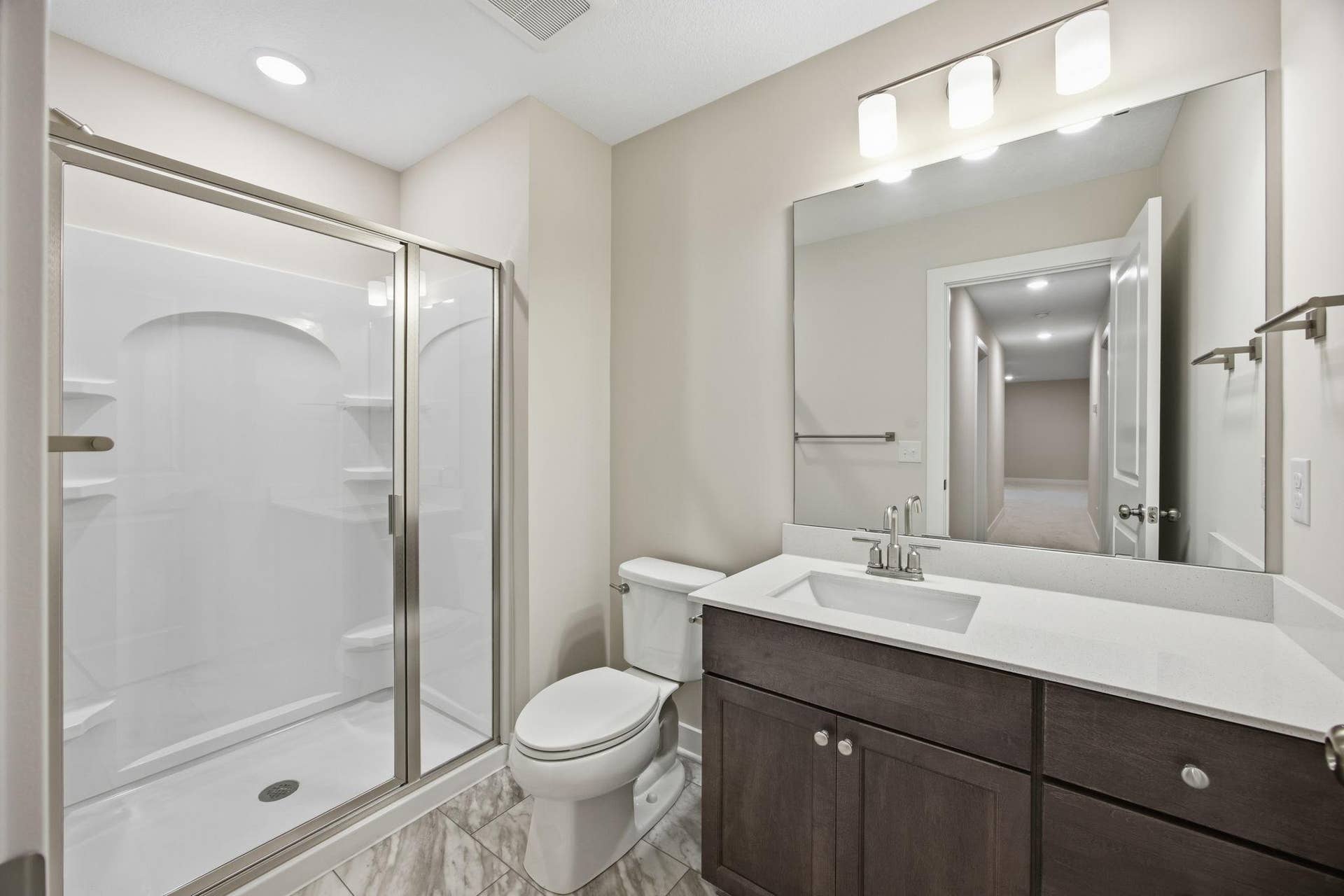 2399 Laurie Court W, Roseville, MN 55113 Lower-Level Three-Quarter Bathroom Featuring Modern Finishes