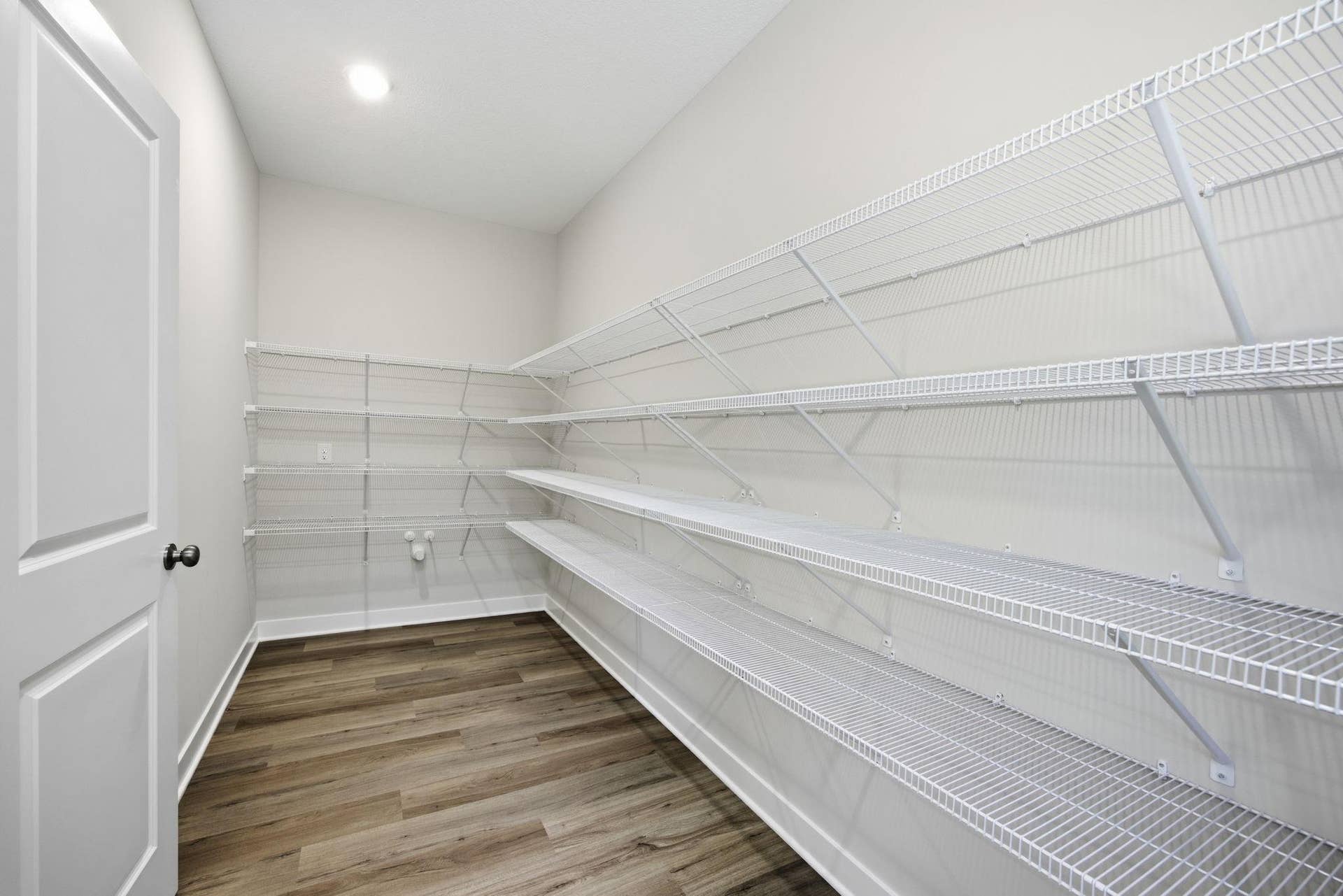 2399 Laurie Court W, Roseville, MN 55113 The extraordinary 15' x 6' walk-in pantry provides ample space for storage, organization, and convenient meal preparation.