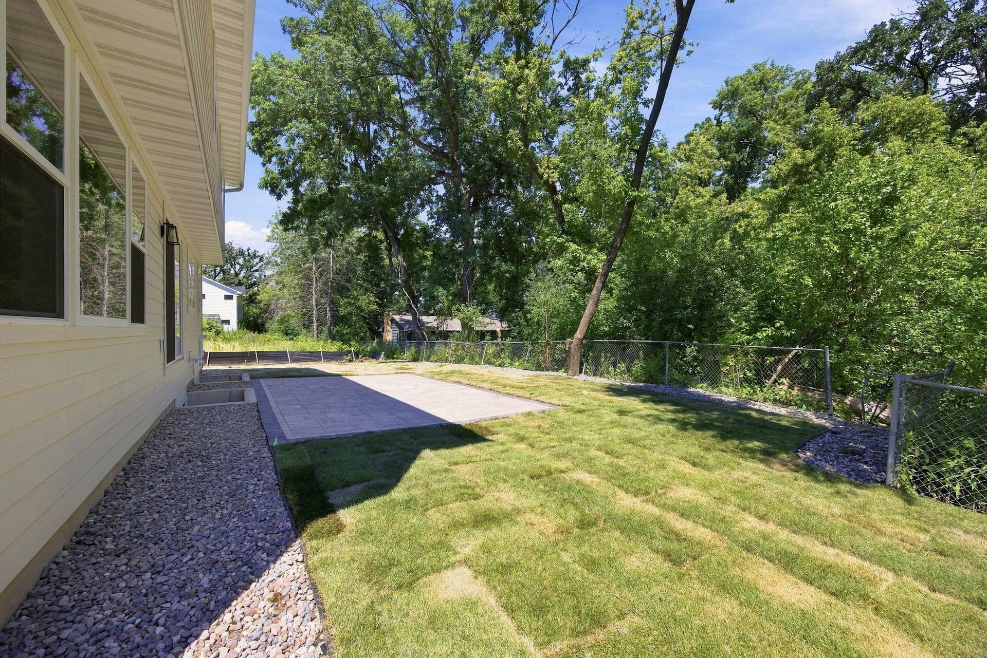 2399 Laurie Court W, Roseville, MN 55113 Brand-new landscaping, fresh sod, and a new stone patio, all completed in July 2026.