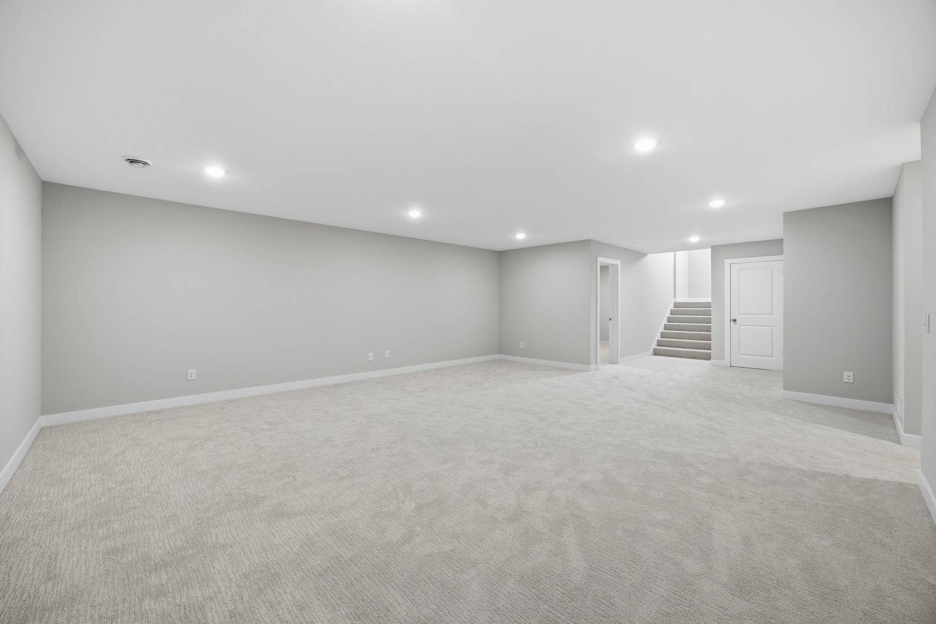 2399 Laurie Court W, Roseville, MN 55113 Spacious unfurnished family room in the finished lower level, ready for your personal touch.