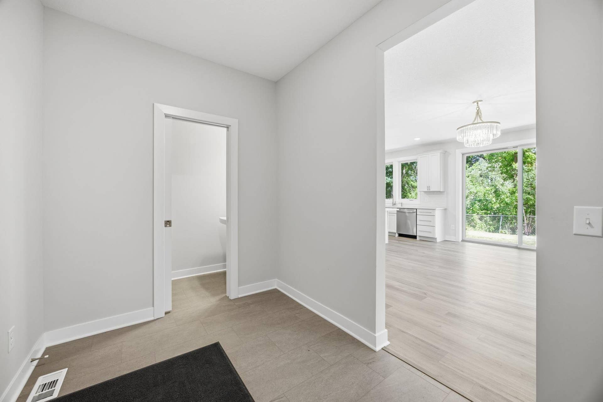2399 Laurie Court W, Roseville, MN 55113 The 10' x 7' mudroom provides a practical transition from the garage and is complemented by a nearby half bath.