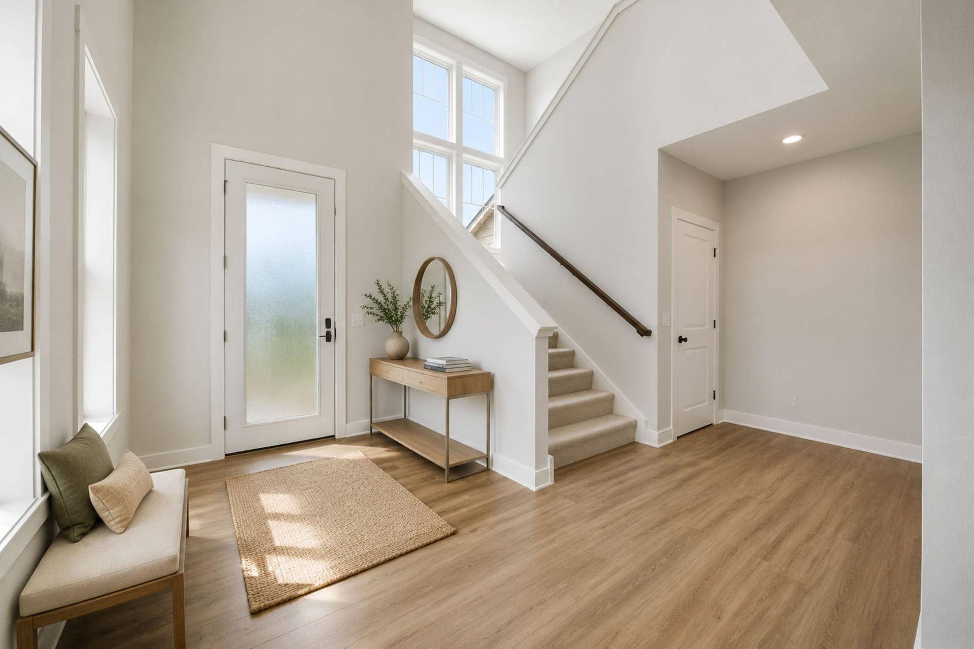 2399 Laurie Court W, Roseville, MN 55113 Step into a grand two-story foyer filled with natural light from expansive windows, creating a bright and welcoming first impression. You'll immediately notice the impressive wide staircase, while a discreet door provides access to the lower level.