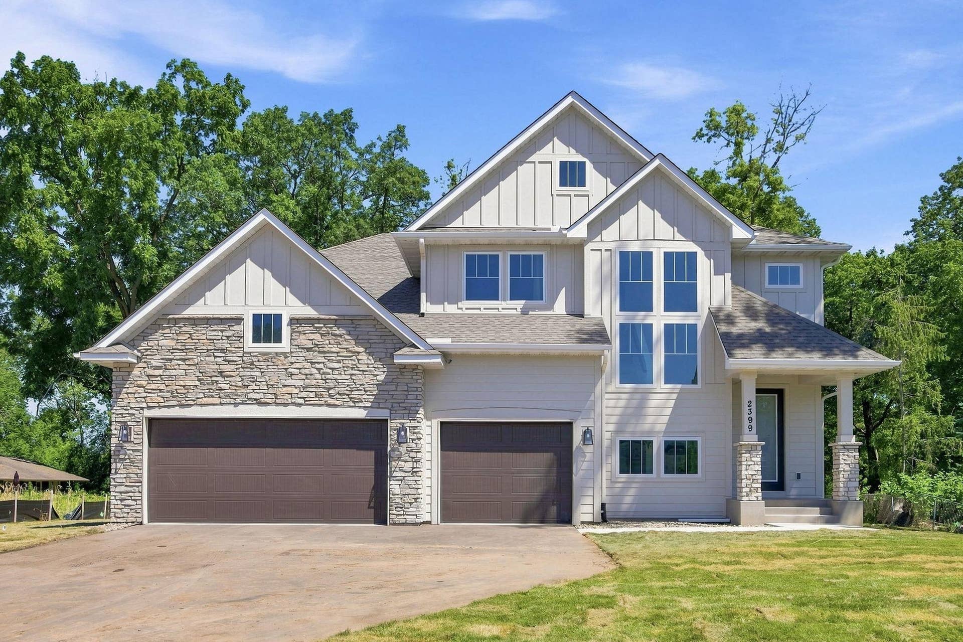 2399 Laurie Court W, Roseville, MN 55113 Custom-designed and newly built in 2025! This stunning home features an impressive stone-accented front exterior with durable fiber cement siding.