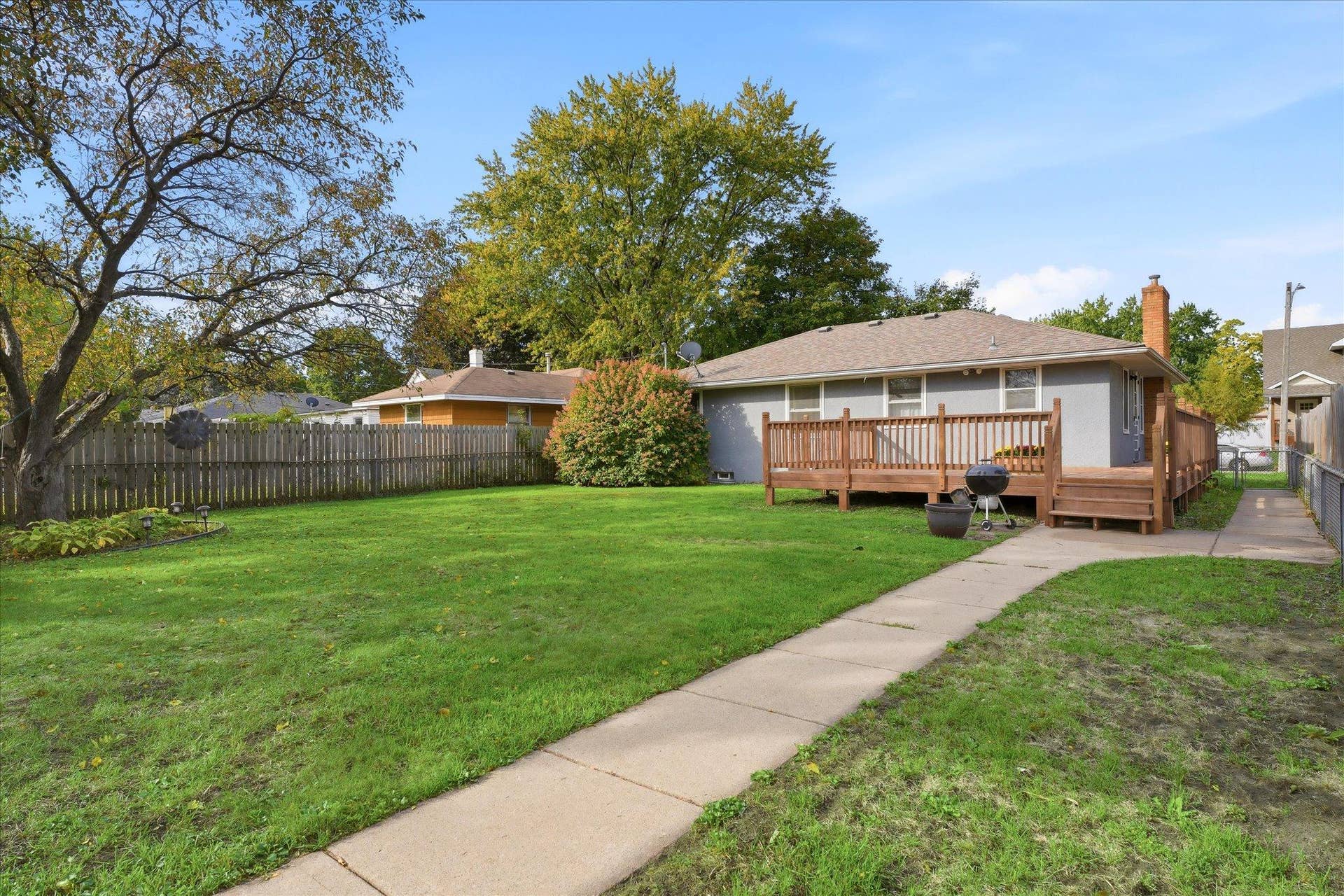 4840 N 6th Street, 41, Minneapolis, MN 55430 Beautiful, fully fenced backyard featuring an abundance of established fruit trees and plants, including a Honeycrisp apple tree, cherry tree, huckleberry tree, blackberry and raspberry bushes, and rhubarb.