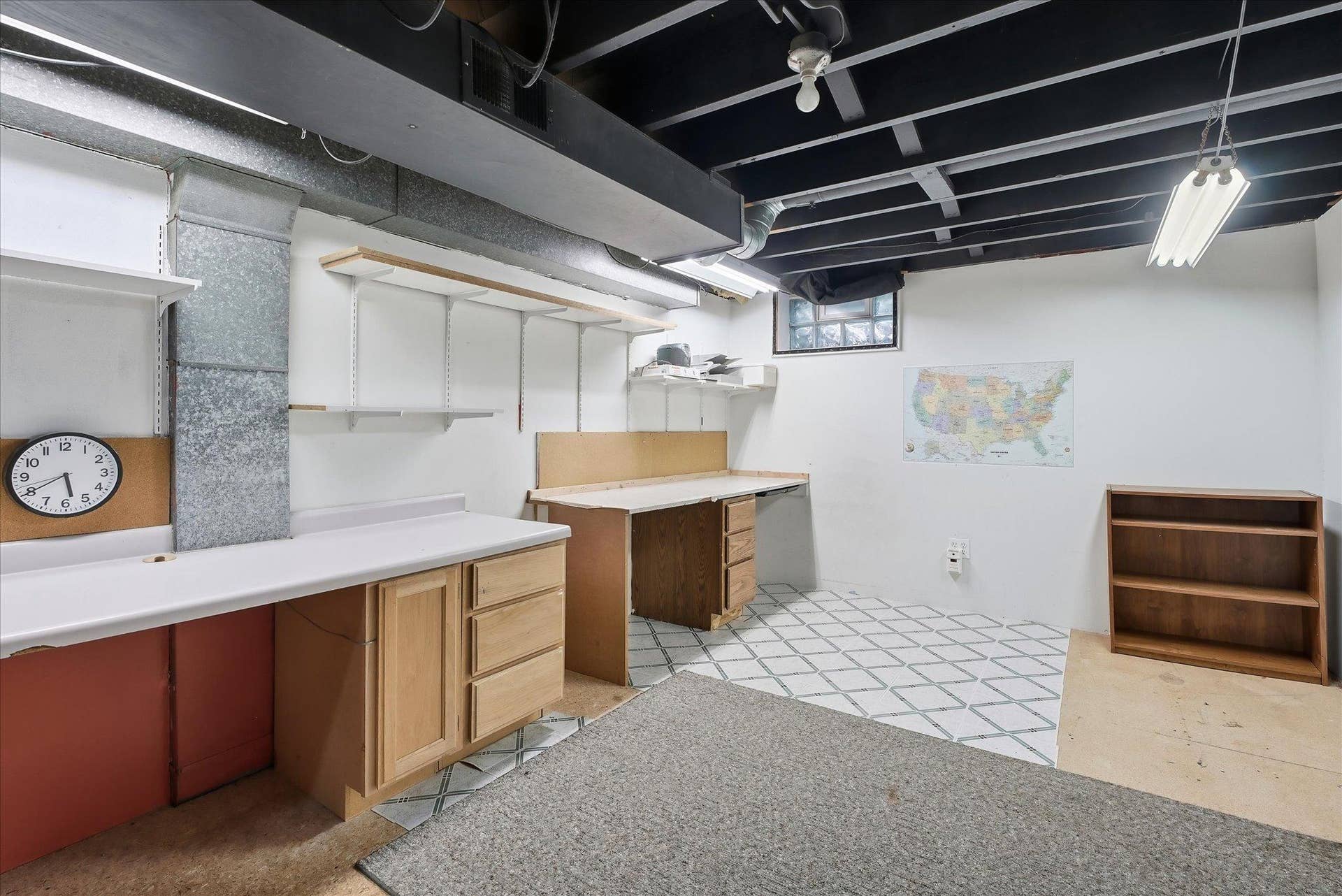 4840 N 6th Street, 41, Minneapolis, MN 55430 Currently featuring a workshop, multiple workbenches, cabinetry, and abundant storage, this versatile area offers endless possibilities for future finishing, additional living space, or hobbies.