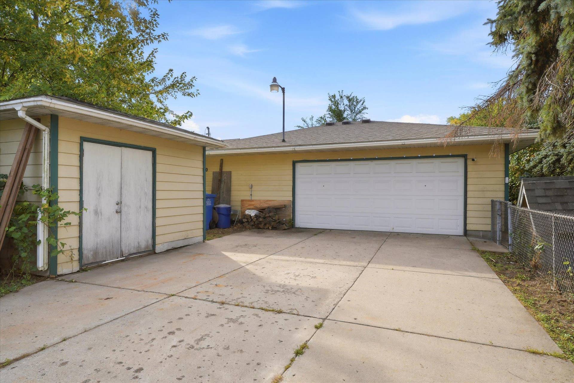 4840 N 6th Street, 41, Minneapolis, MN 55430 Spacious detached, heated garage featuring two 220V outlets, a full-length floor drain, wall-mounted A/C, 100-amp electrical service, and a separate gas meter. Ideal for vehicles, hobbies, and workshop projects.