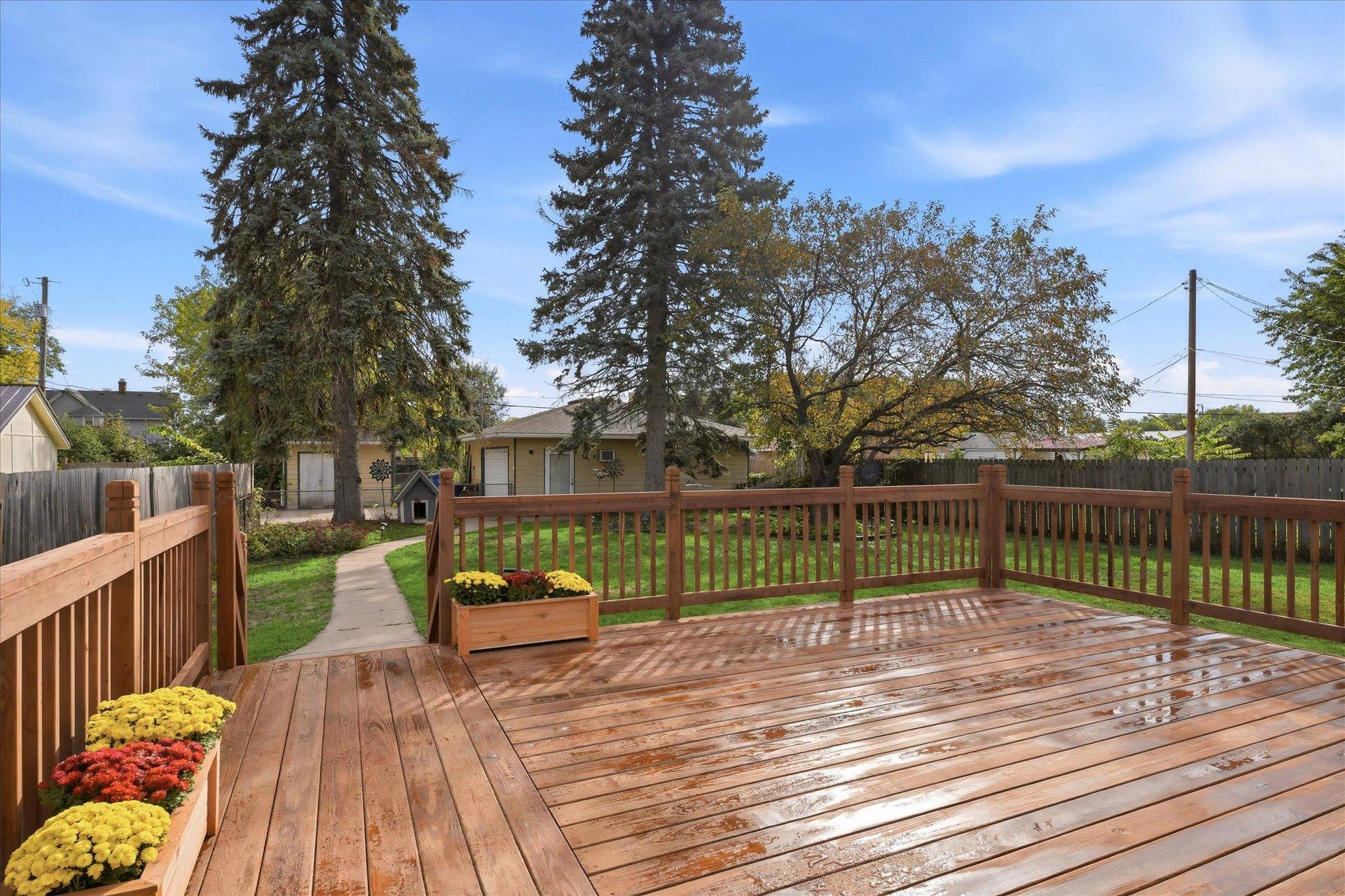 4840 N 6th Street, 41, Minneapolis, MN 55430 Spacious New wood deck overlooking the beautiful backyard, offering plenty of room for grilling, outdoor dining, entertaining, and relaxing.