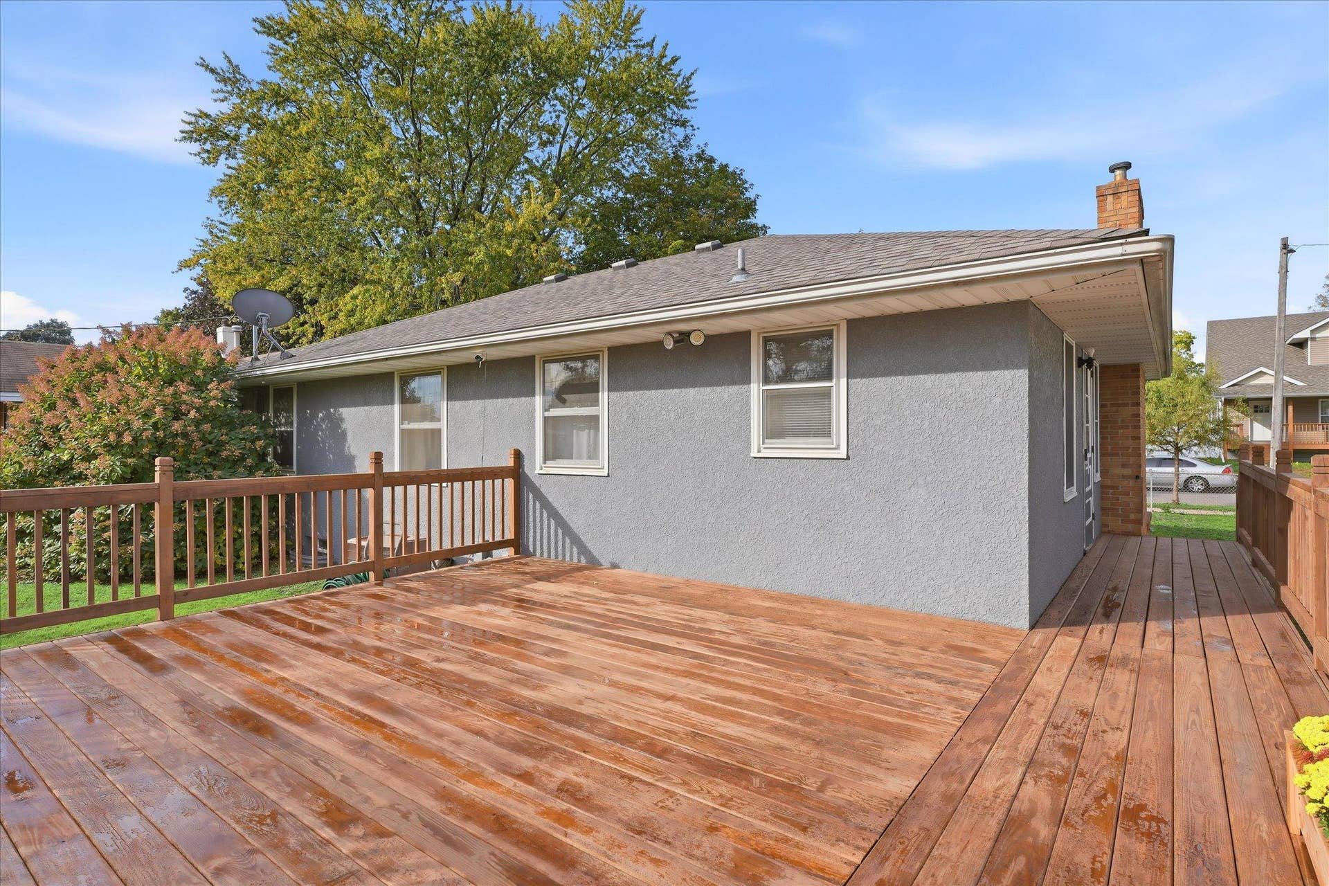 4840 N 6th Street, 41, Minneapolis, MN 55430 Generously sized deck with plenty of space for outdoor furniture and gatherings, plus convenient access to the home and backyard.