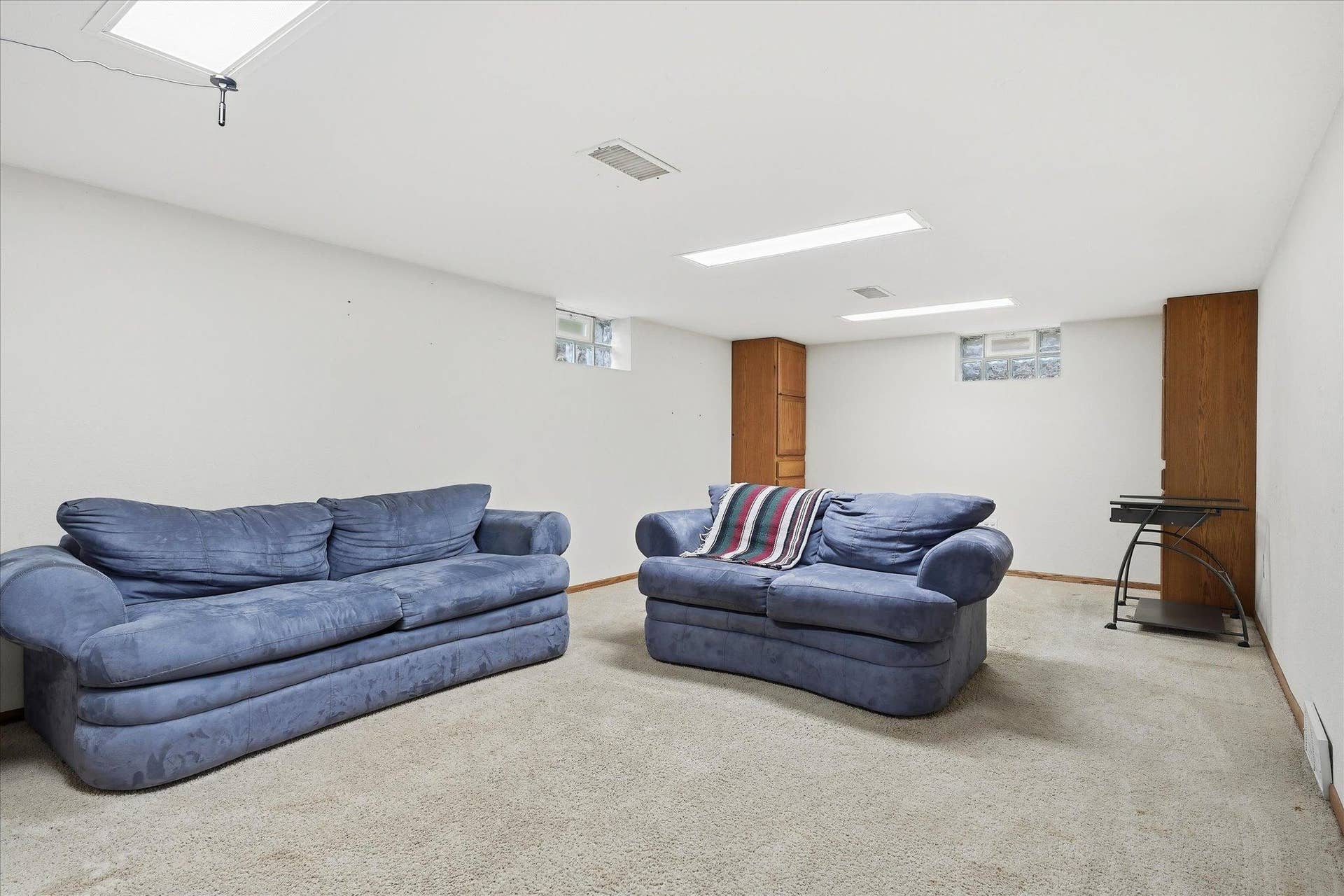 4840 N 6th Street, 41, Minneapolis, MN 55430 Spacious lower-level family room featuring neutral finishes, comfortable carpeting, and plenty of room for entertaining, relaxing, or creating a recreation space.