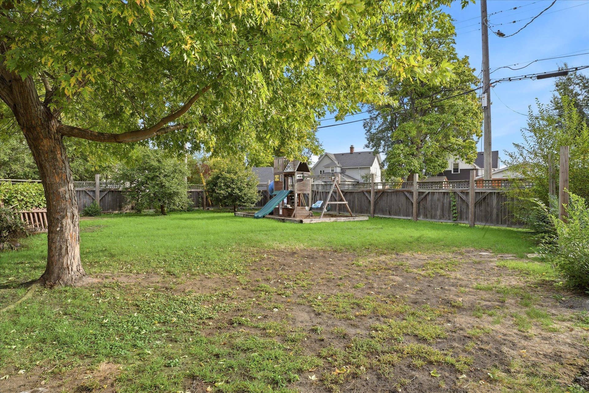 4840 N 6th Street, 41, Minneapolis, MN 55430 Spacious .37 acre yard with mature shade trees, green space, and a large playset (can stay or go). Plenty of room to enjoy outdoor activities.