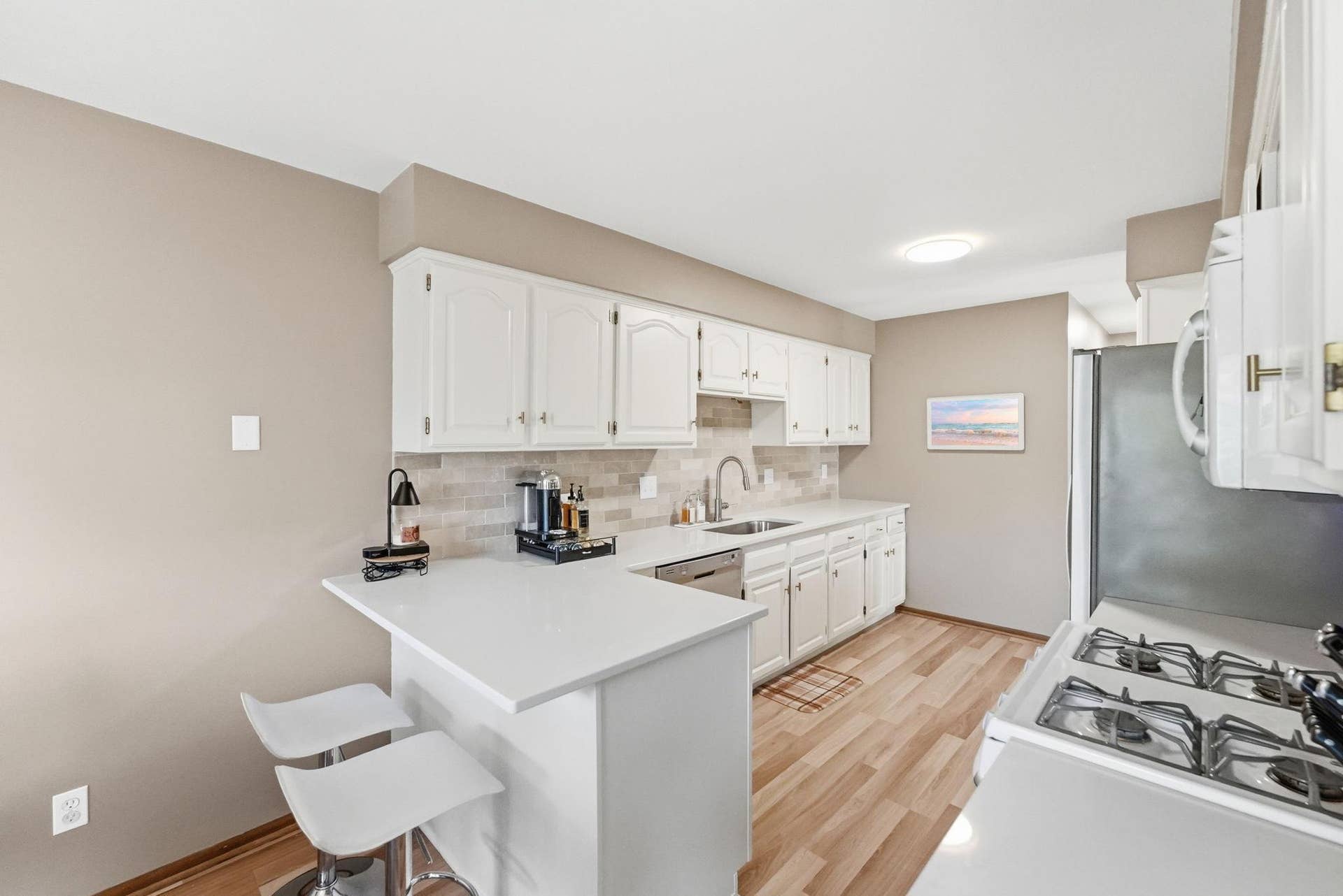 4492 Clover Lane, Eagan, MN 55122 Modern kitchen with quartz counter tops and breakfast bar