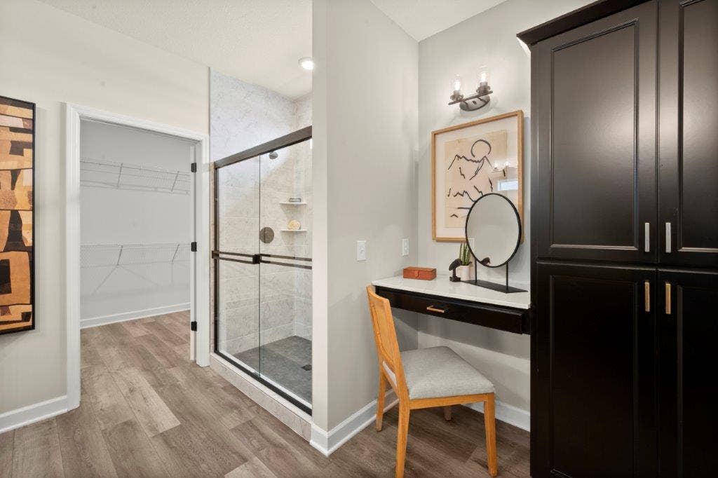 Owner's bath freatures a ceramic tiled over-sized shower, plus a make up vanity space and large linen cabinet