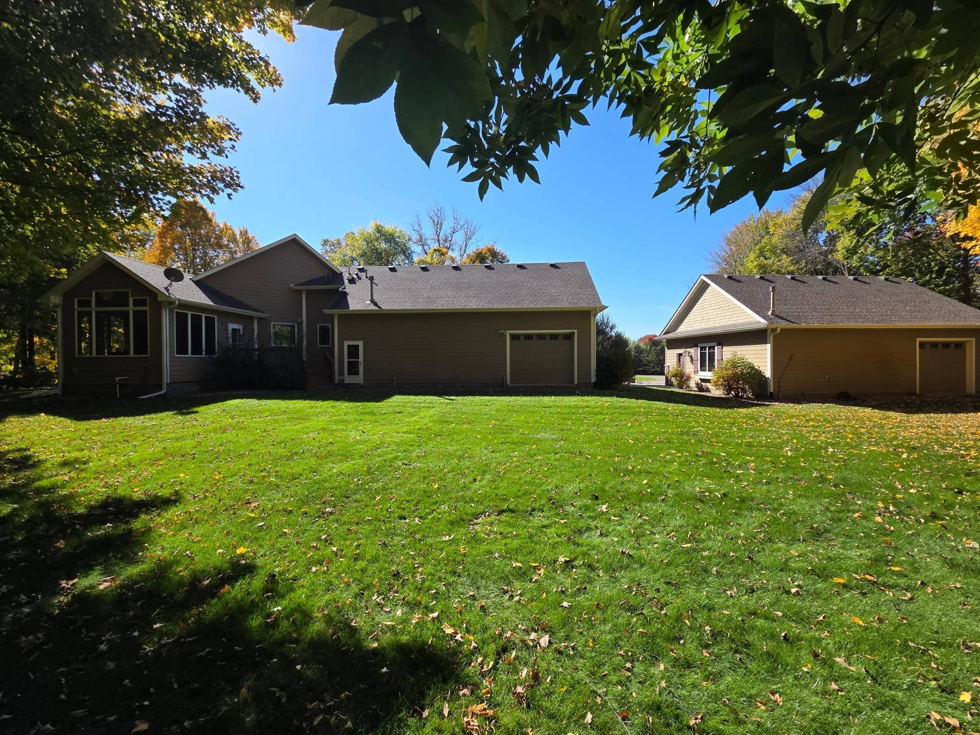 9284 Ehler Avenue SE, Delano, MN 55328 ehler back house with garage overhead doors on each.jpg
