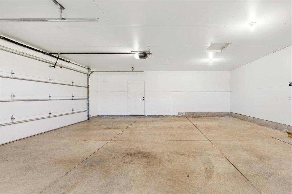 2063 Sandstone Loop N, Sartell, MN 56377 Generous insulated 3-car garage